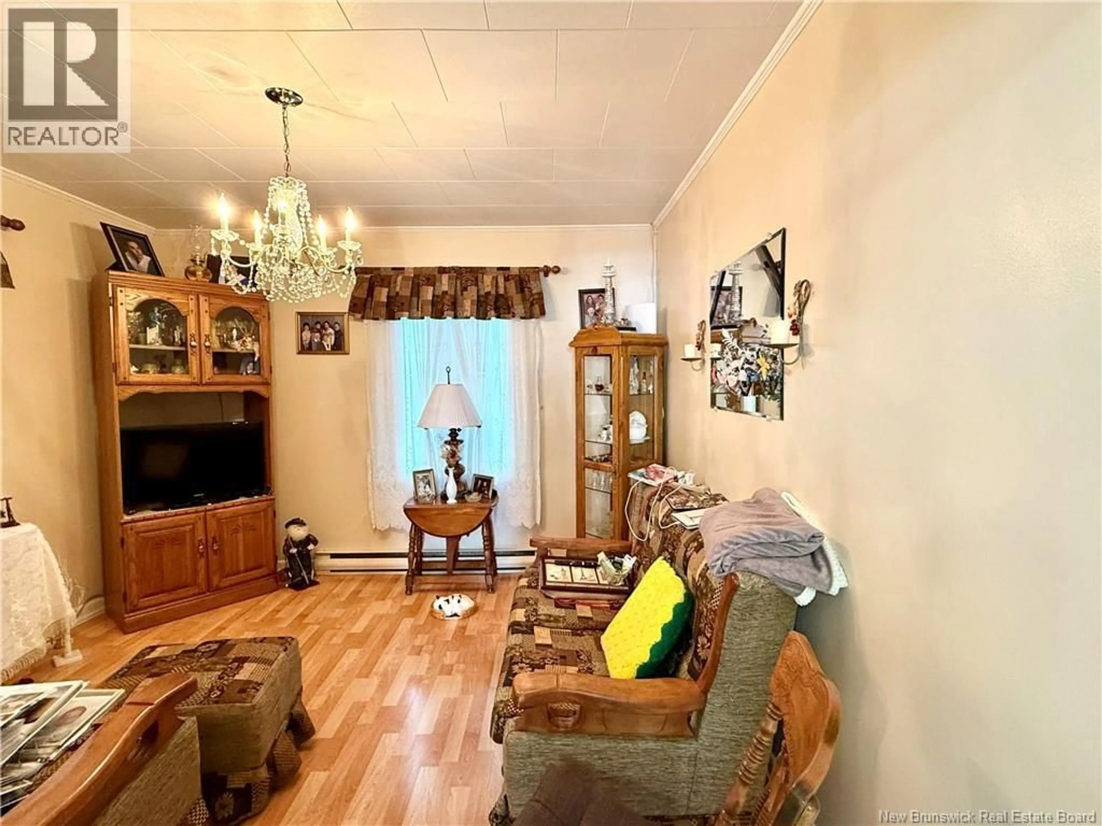 Living room with furniture, wood/laminate floor for 88 DAIGLE ROAD, Edmundston New Brunswick E3V1M1