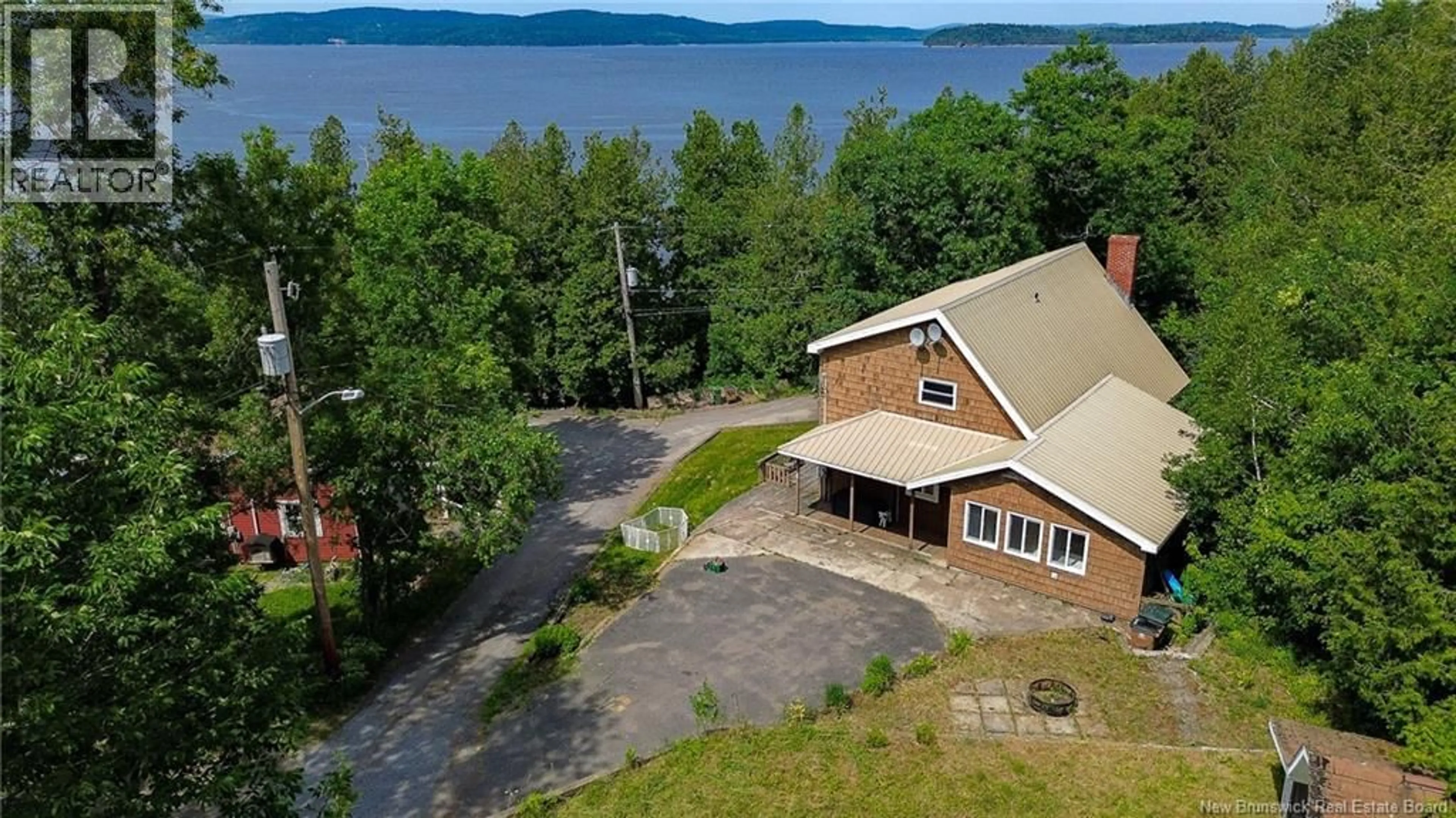 A pic from outside/outdoor area/front of a property/back of a property/a pic from drone, water/lake/river/ocean view for 38 HIGHVIEW ROADWAY, Saint John New Brunswick E2M6P9