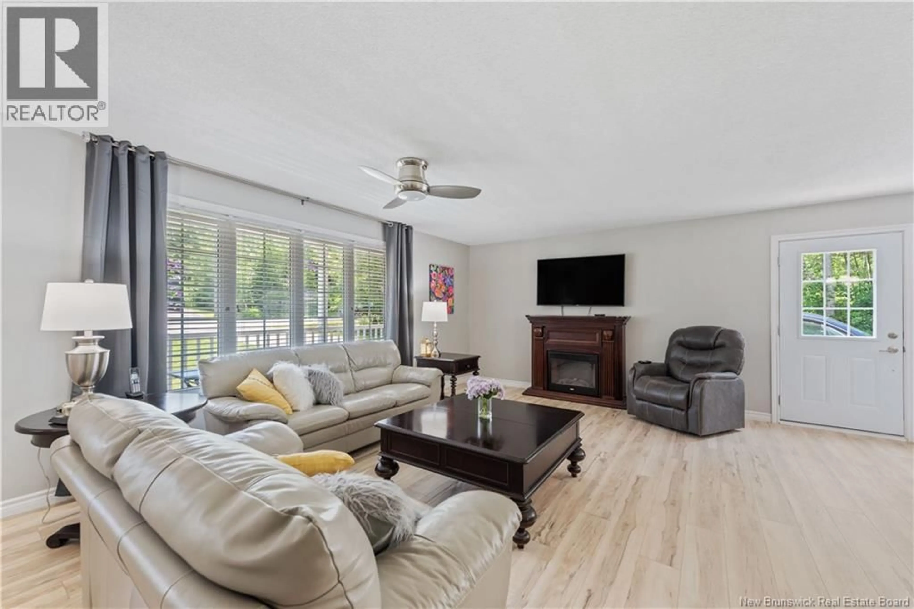 Living room with furniture, wood/laminate floor for 16 WOODWORTH STREET, Lower Coverdale New Brunswick E1J1L3