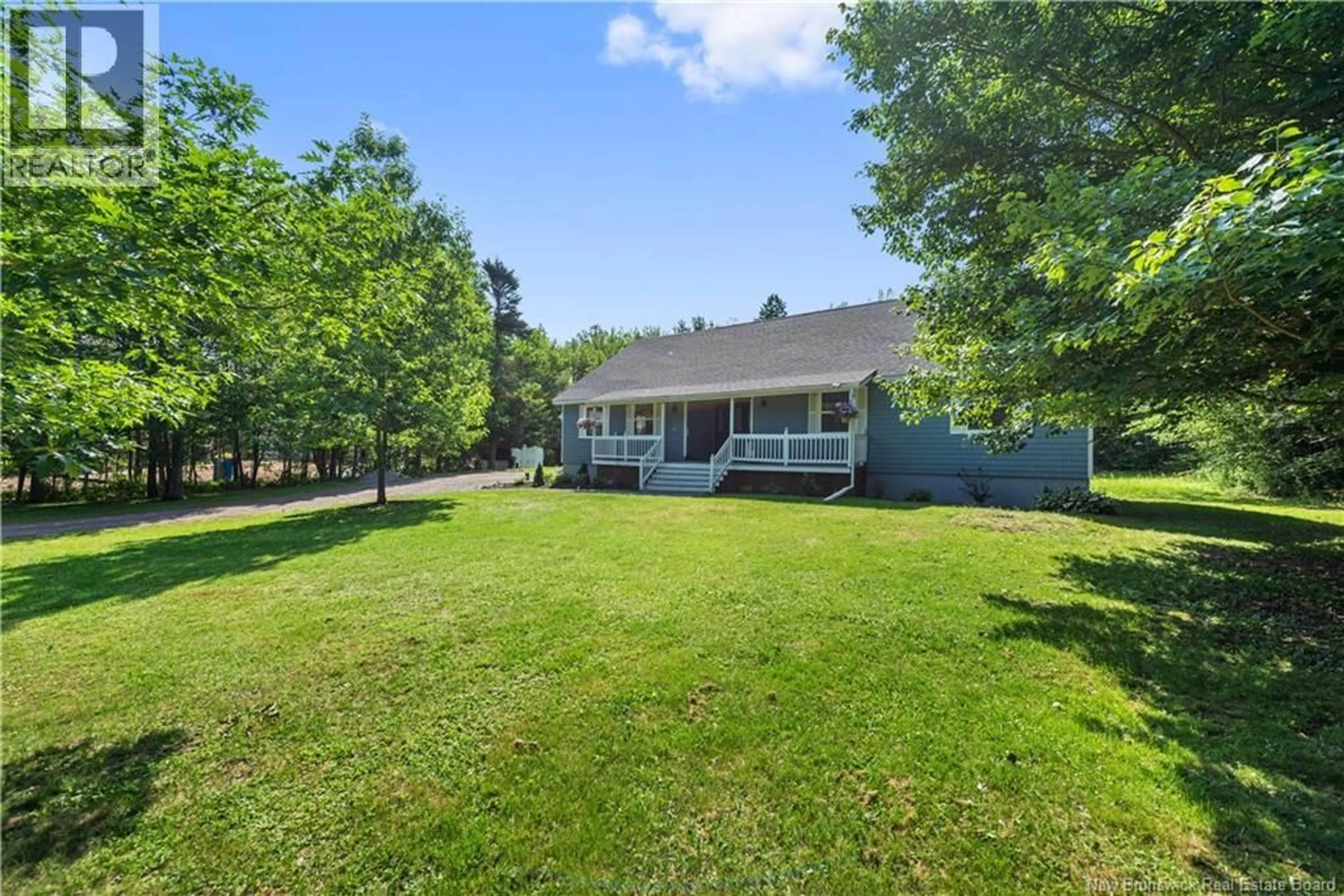 A pic from outside/outdoor area/front of a property/back of a property/a pic from drone, water/lake/river/ocean view for 32 RIVERBEND, Turtle Creek New Brunswick E1J2B3