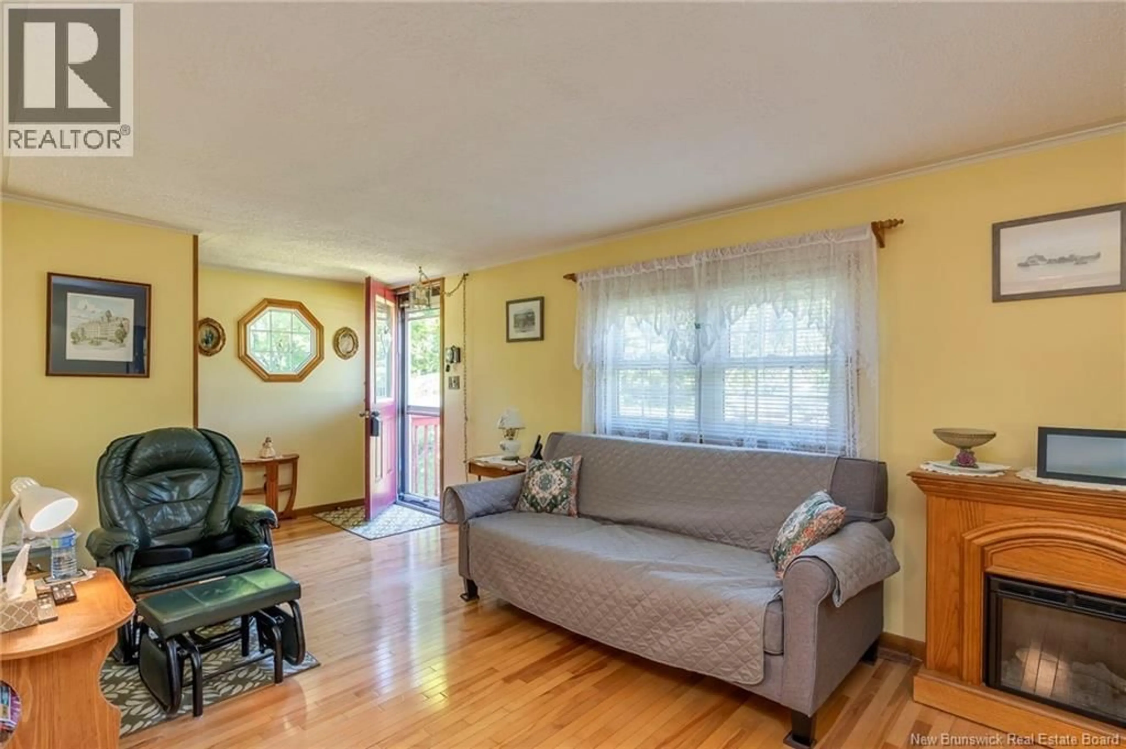 Living room with furniture, wood/laminate floor for 3066 LOCH LOMOND ROAD, Saint John New Brunswick E2N1B3