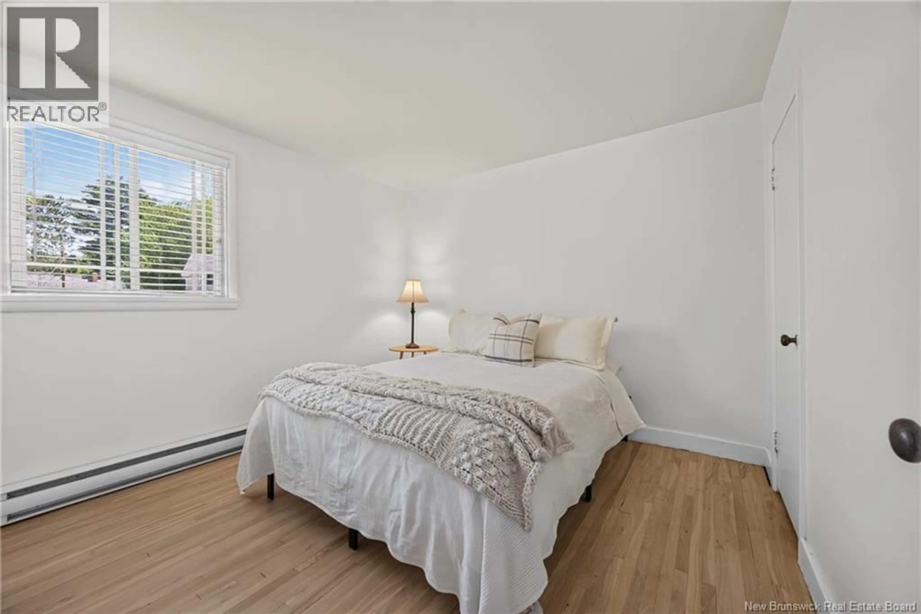 Bedroom with bed, wood/laminate floor for 25 WOODBINE COURT, Fredericton New Brunswick E3B2N5
