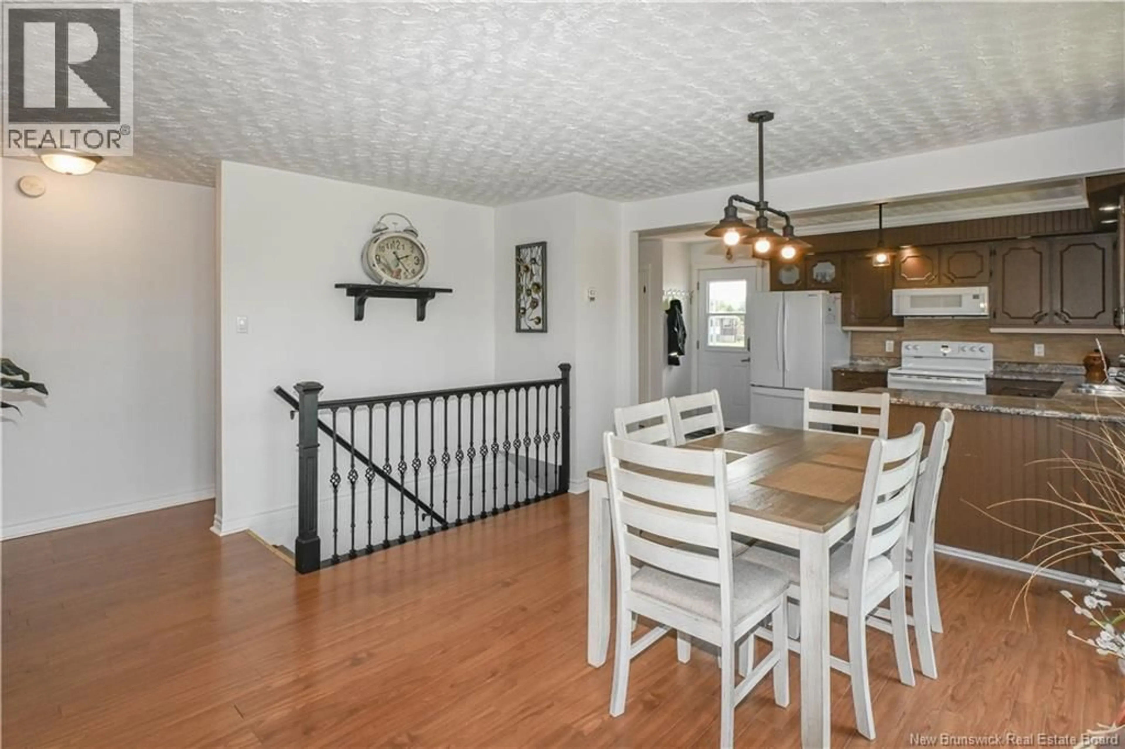 Open concept kitchen, wood/laminate floor for 20 DU LAC ROAD, Val-Comeau New Brunswick E1X4A3