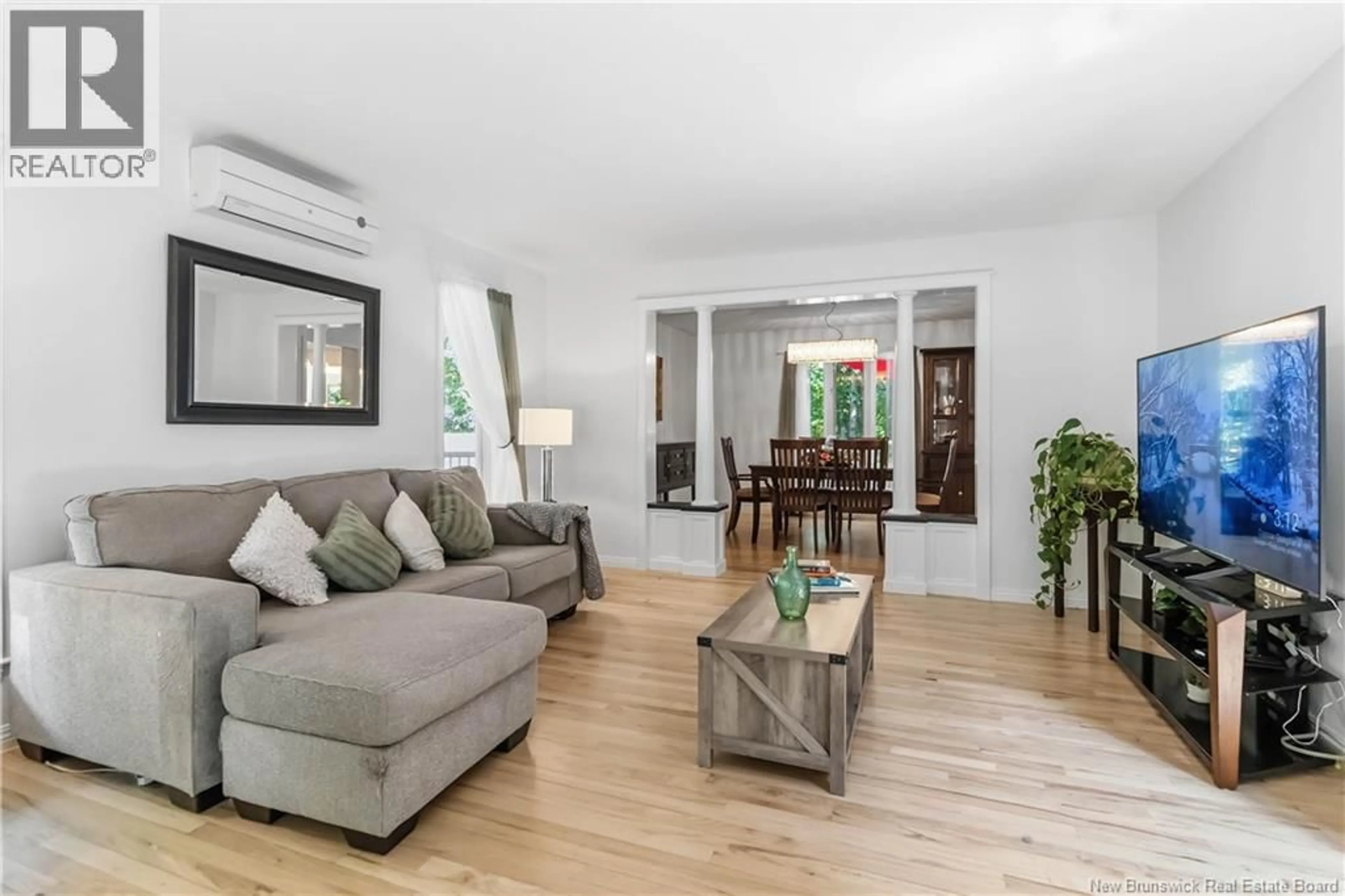 Living room with furniture, wood/laminate floor for 1 BASSWOOD COURT, Moncton New Brunswick E1G2E5