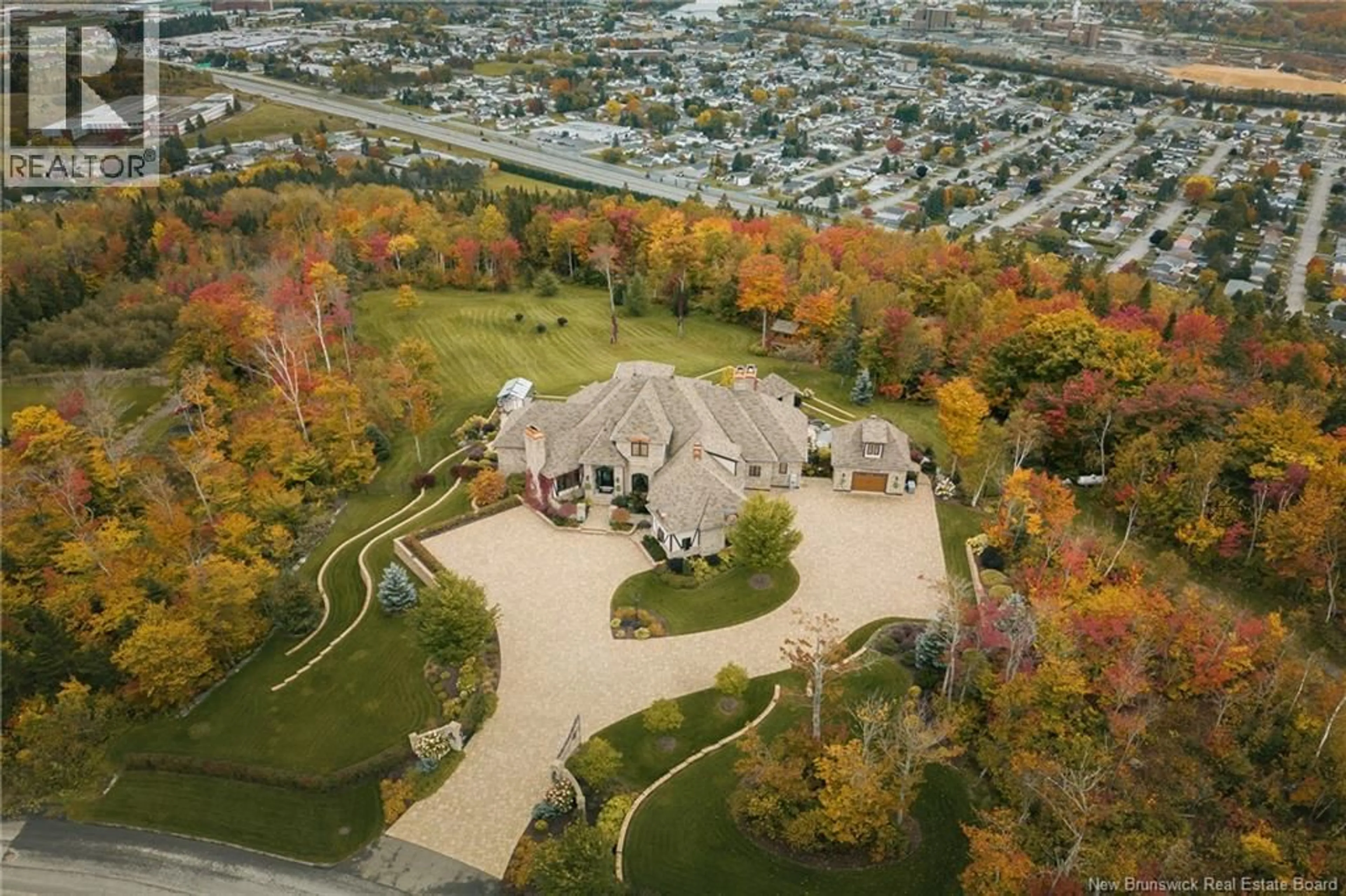 A pic from outside/outdoor area/front of a property/back of a property/a pic from drone, unknown for 92 DE LA FALAISE STREET, Edmundston New Brunswick E3V0C4