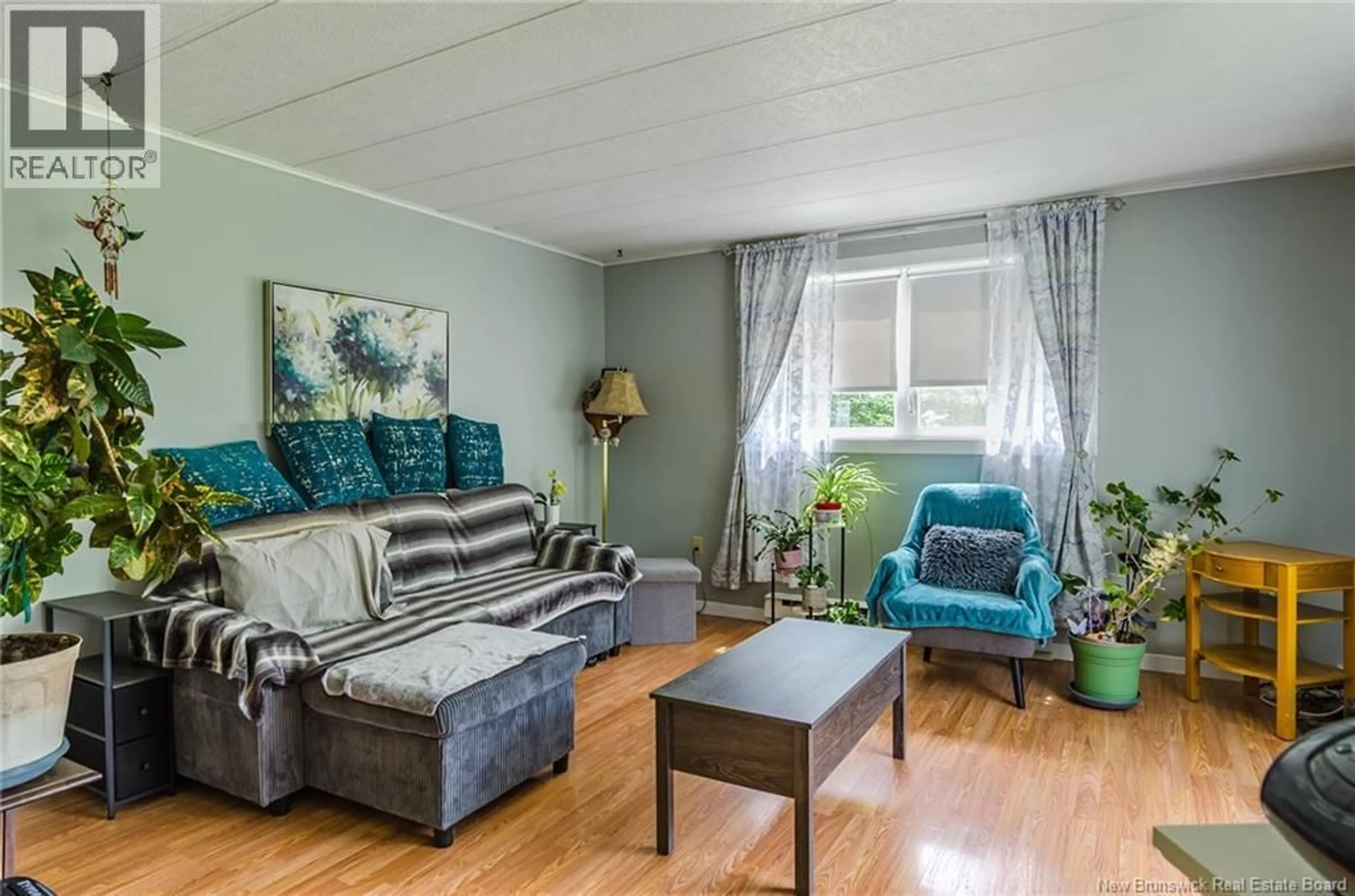 Living room with furniture, wood/laminate floor for 4 BACK ROAD, Summerfield New Brunswick E4G2L2