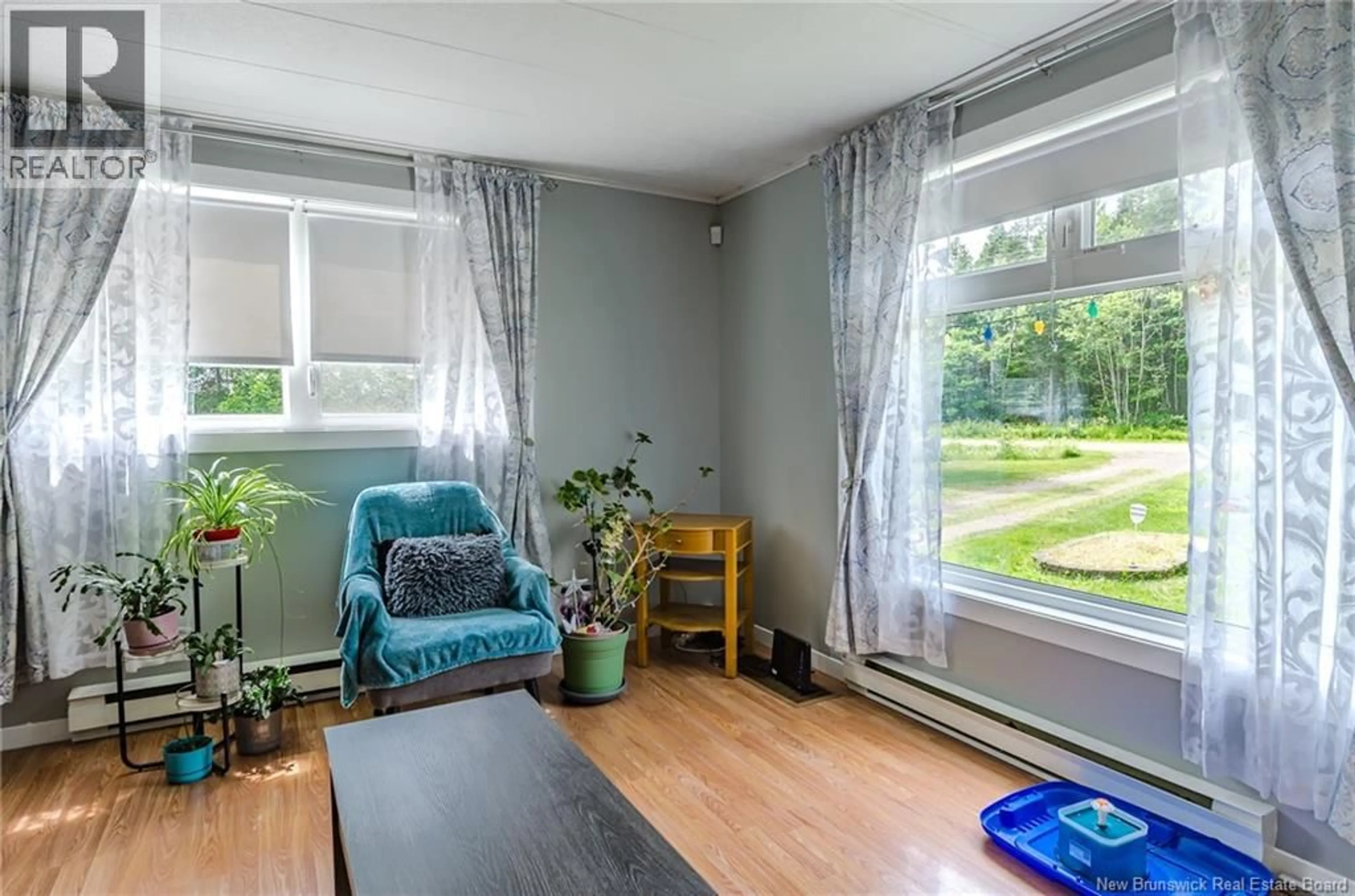 Living room with furniture, wood/laminate floor for 4 BACK ROAD, Summerfield New Brunswick E4G2L2