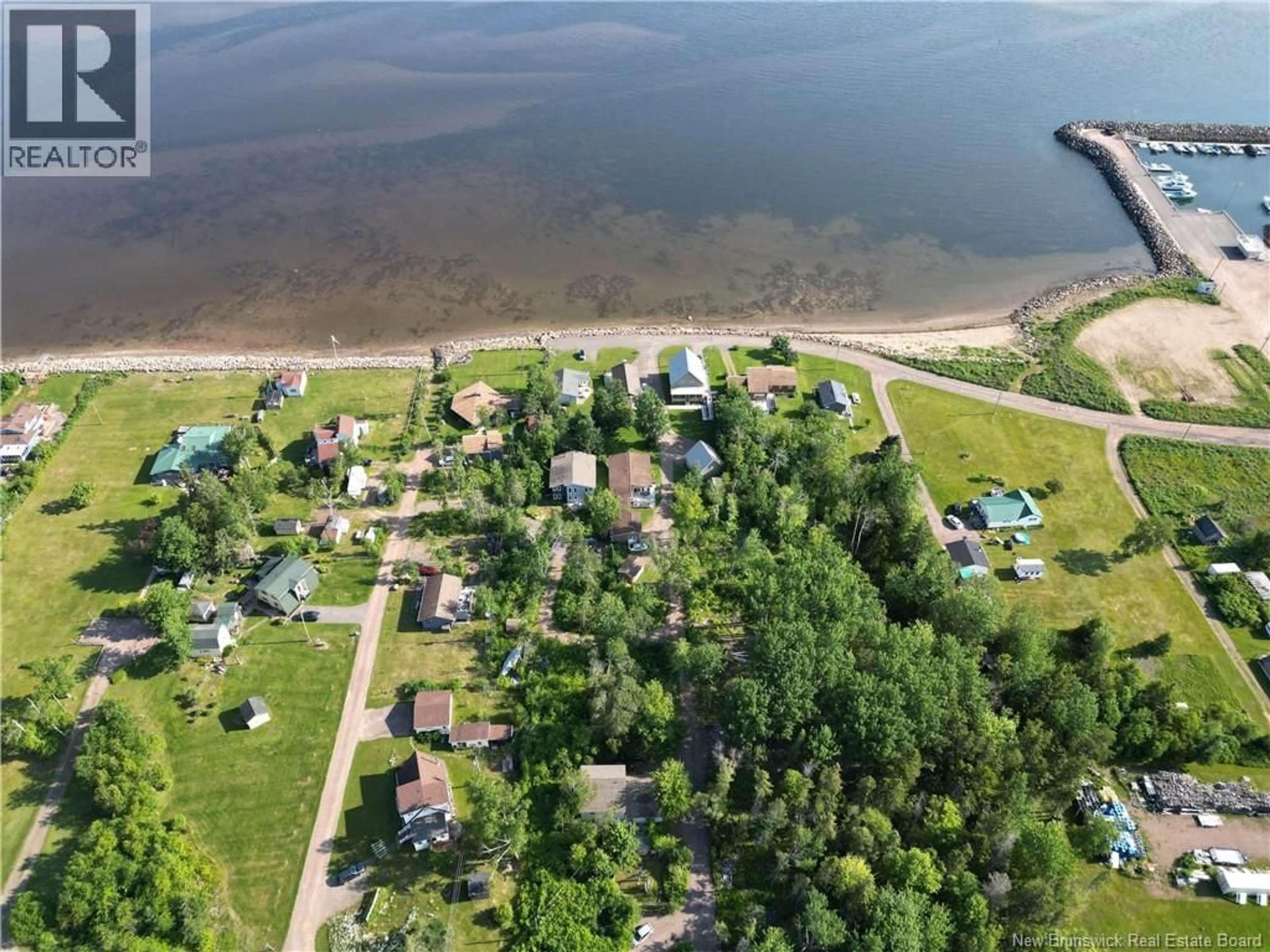 A pic from outside/outdoor area/front of a property/back of a property/a pic from drone, water/lake/river/ocean view for 19 CHEMIN DU PETIT BOIS, Grand-Barachois New Brunswick E4P7K4