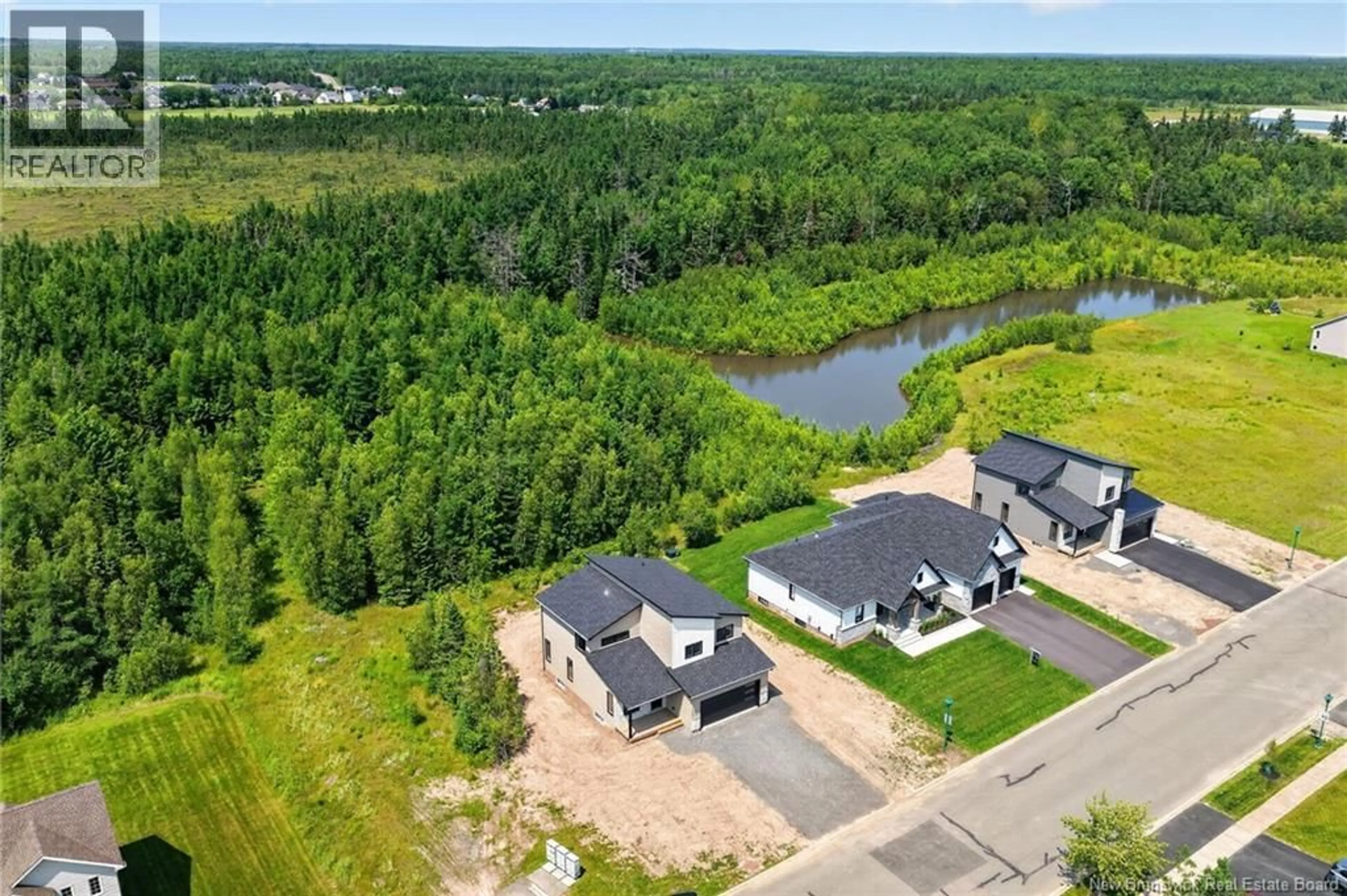 A pic from outside/outdoor area/front of a property/back of a property/a pic from drone, water/lake/river/ocean view for 89 ROYAL OAKS BOULEVARD, Moncton New Brunswick E1H3L2