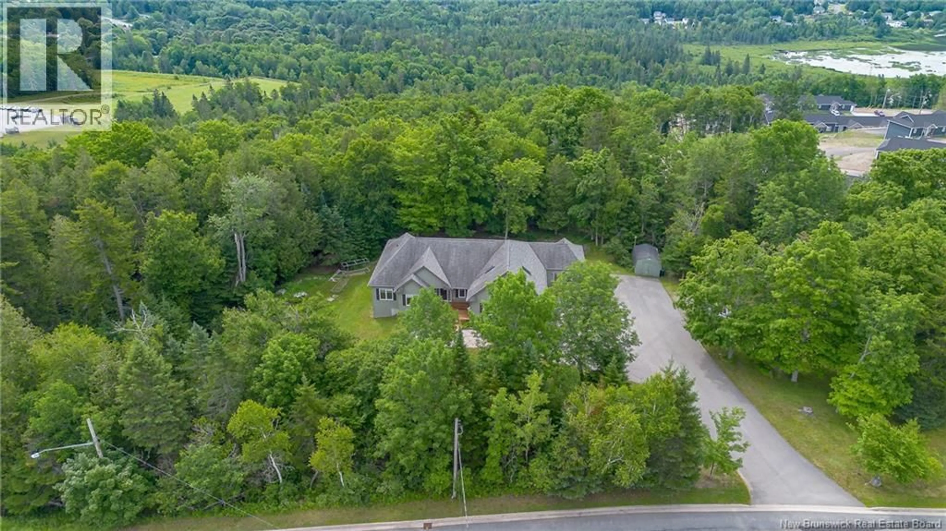 A pic from outside/outdoor area/front of a property/back of a property/a pic from drone, forest/trees view for 186 PETTINGILL ROAD, Quispamsis New Brunswick E2E2V6