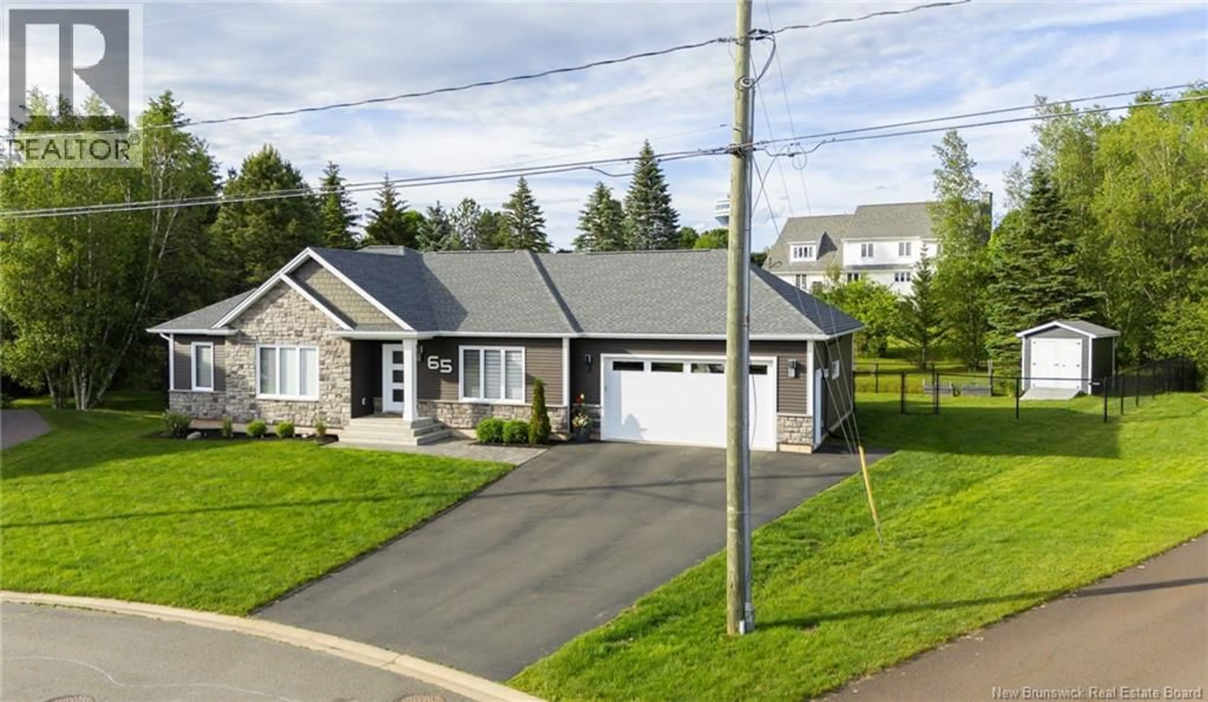 Home with vinyl exterior material, street for 65 ABOITEAU, Dieppe New Brunswick E1A8Z8