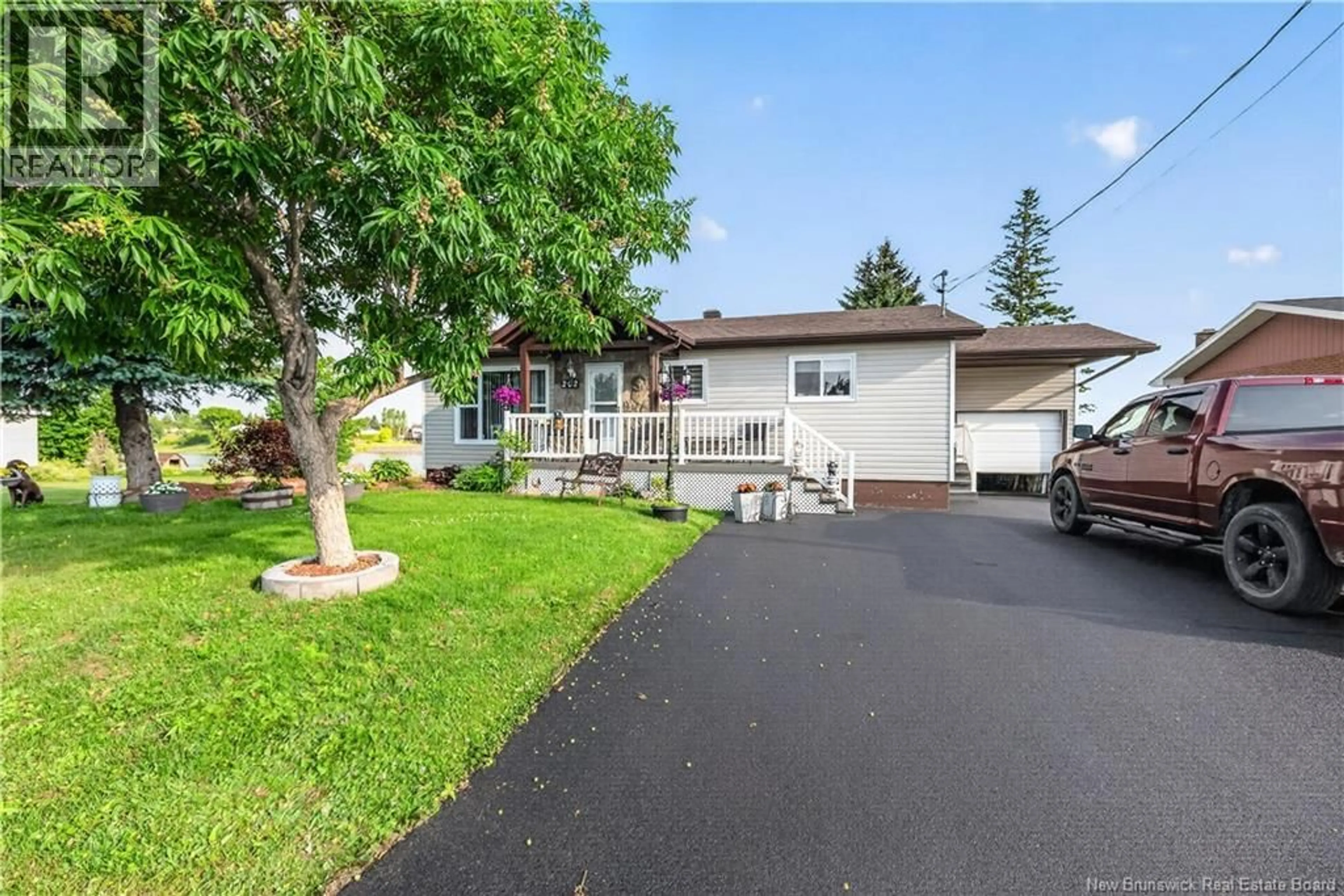 Home with vinyl exterior material, street for 101 RUE MARIE, Beresford New Brunswick E8K1P8