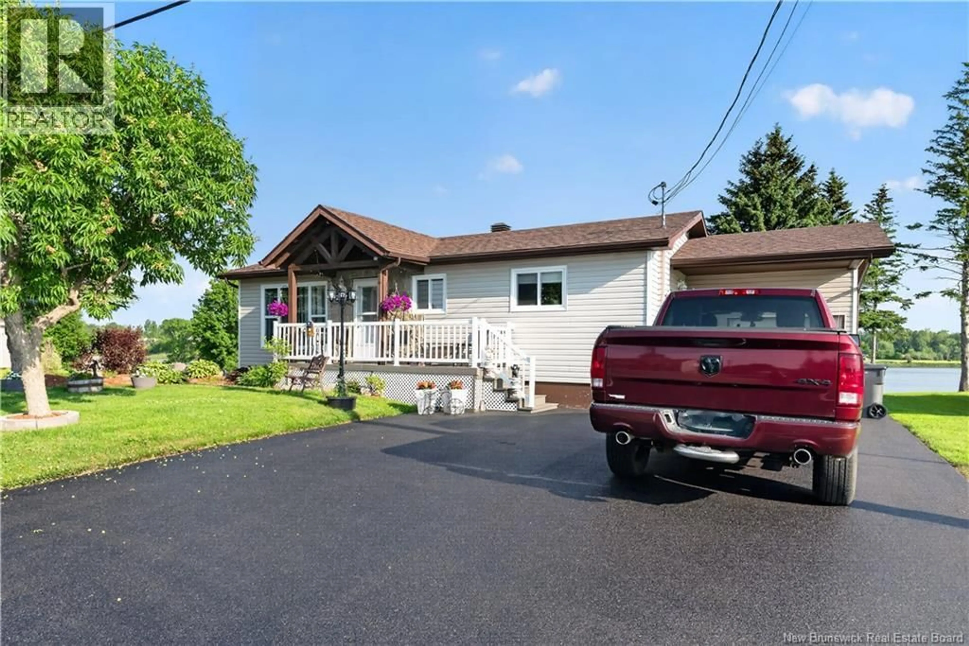 A pic from outside/outdoor area/front of a property/back of a property/a pic from drone, unknown for 101 RUE MARIE, Beresford New Brunswick E8K1P8