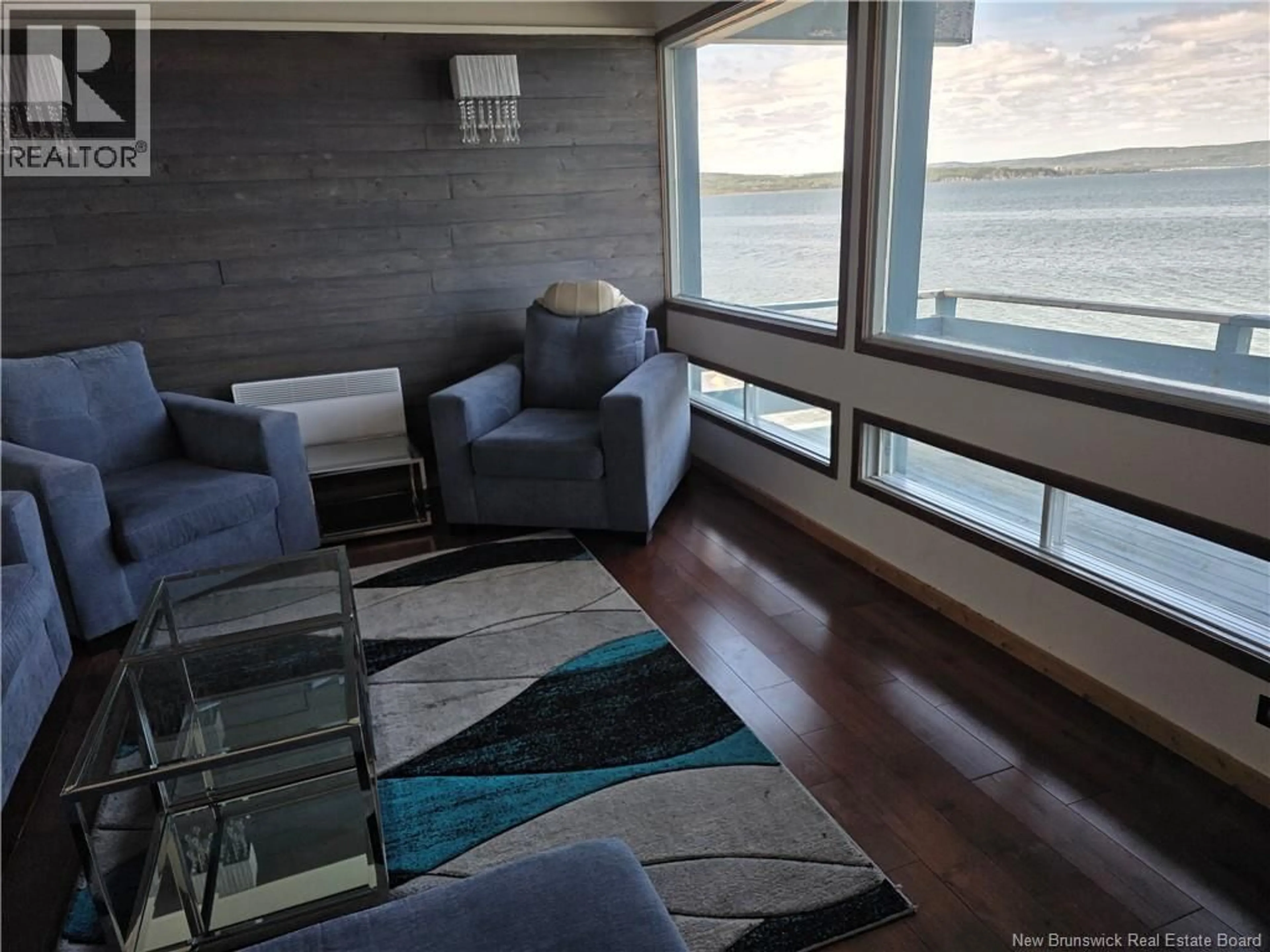 Living room with furniture, wood/laminate floor for 255 CHALEUR, Charlo New Brunswick E8E2B8