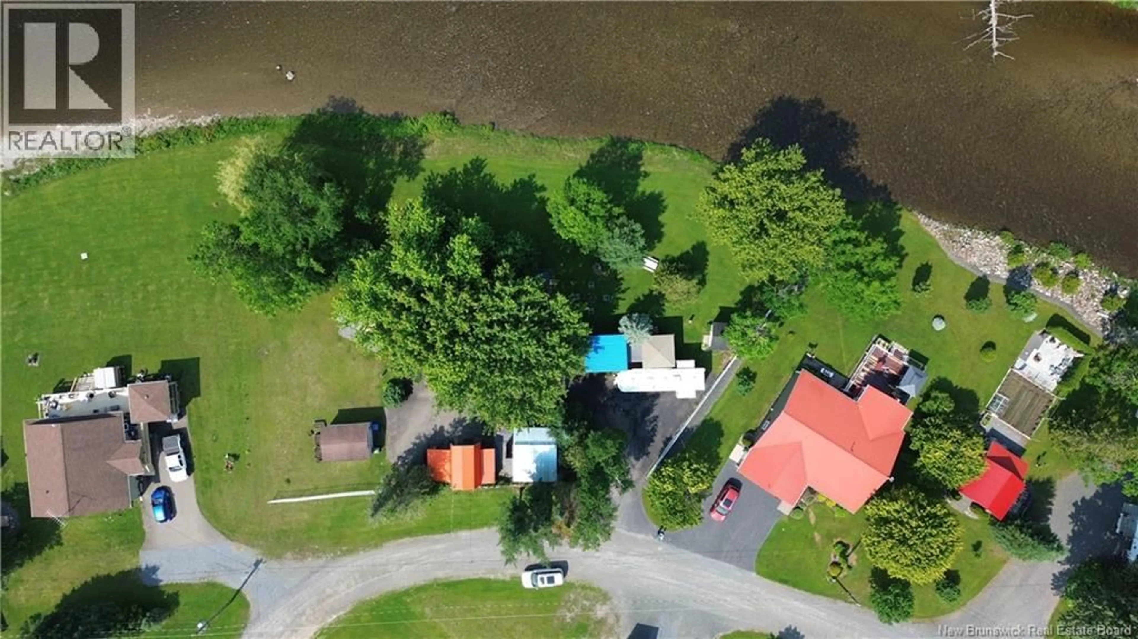 A pic from outside/outdoor area/front of a property/back of a property/a pic from drone, water/lake/river/ocean view for 23 OUELLETTE LANE, New Denmark New Brunswick E7G2H3