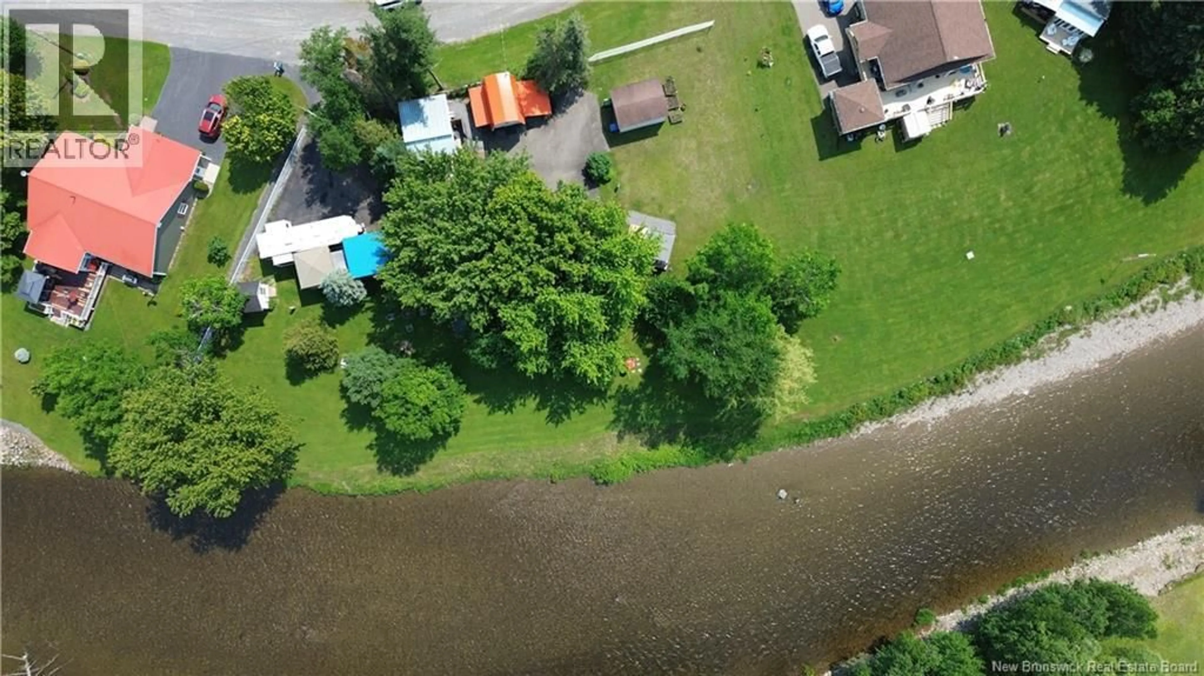 A pic from outside/outdoor area/front of a property/back of a property/a pic from drone, water/lake/river/ocean view for 23 OUELLETTE LANE, New Denmark New Brunswick E7G2H3