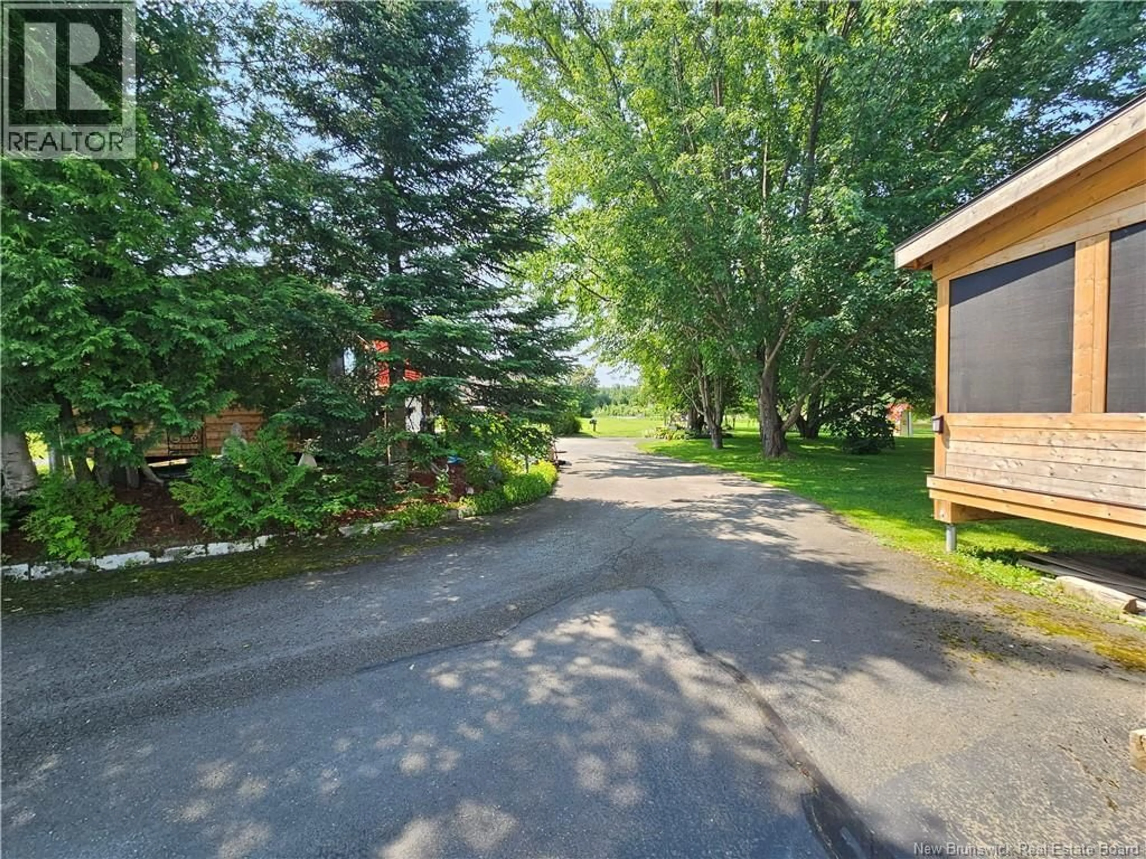 A pic from outside/outdoor area/front of a property/back of a property/a pic from drone, street for 23 OUELLETTE LANE, New Denmark New Brunswick E7G2H3