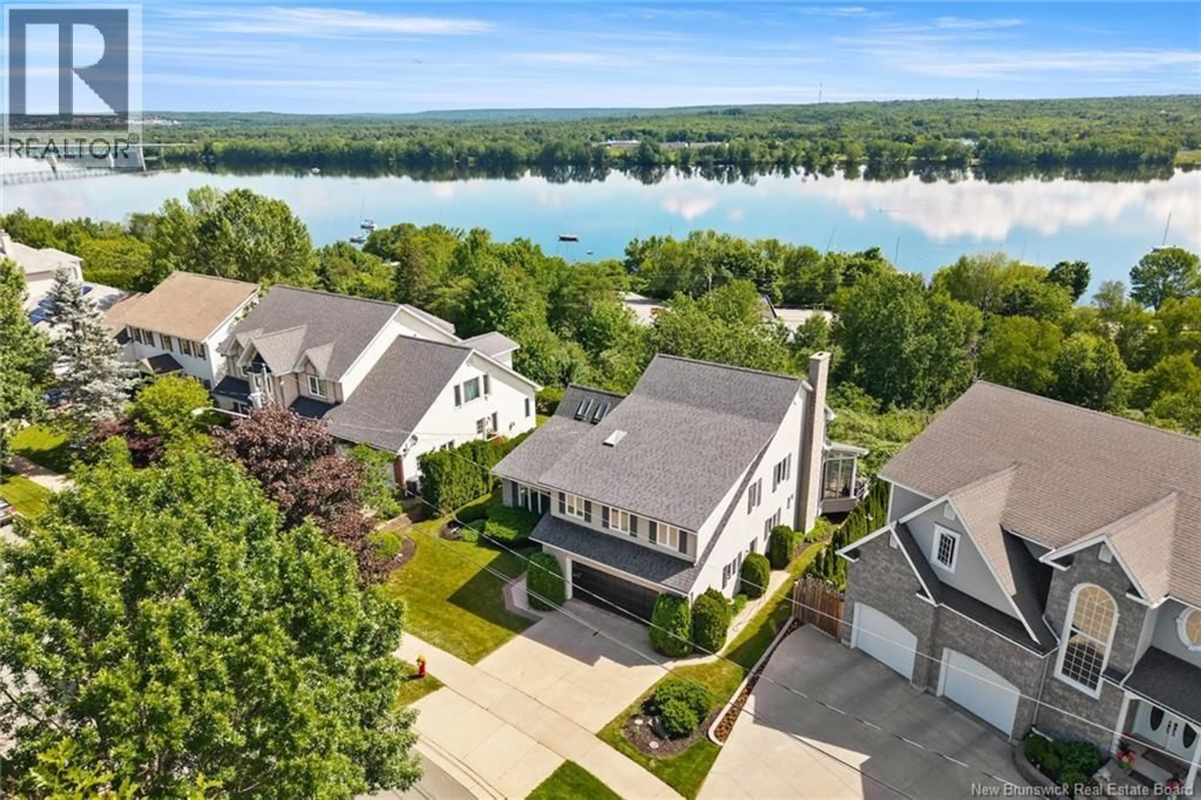 A pic from outside/outdoor area/front of a property/back of a property/a pic from drone, water/lake/river/ocean view for 407 ASPENDALE LANE, Fredericton New Brunswick E3B6Y3