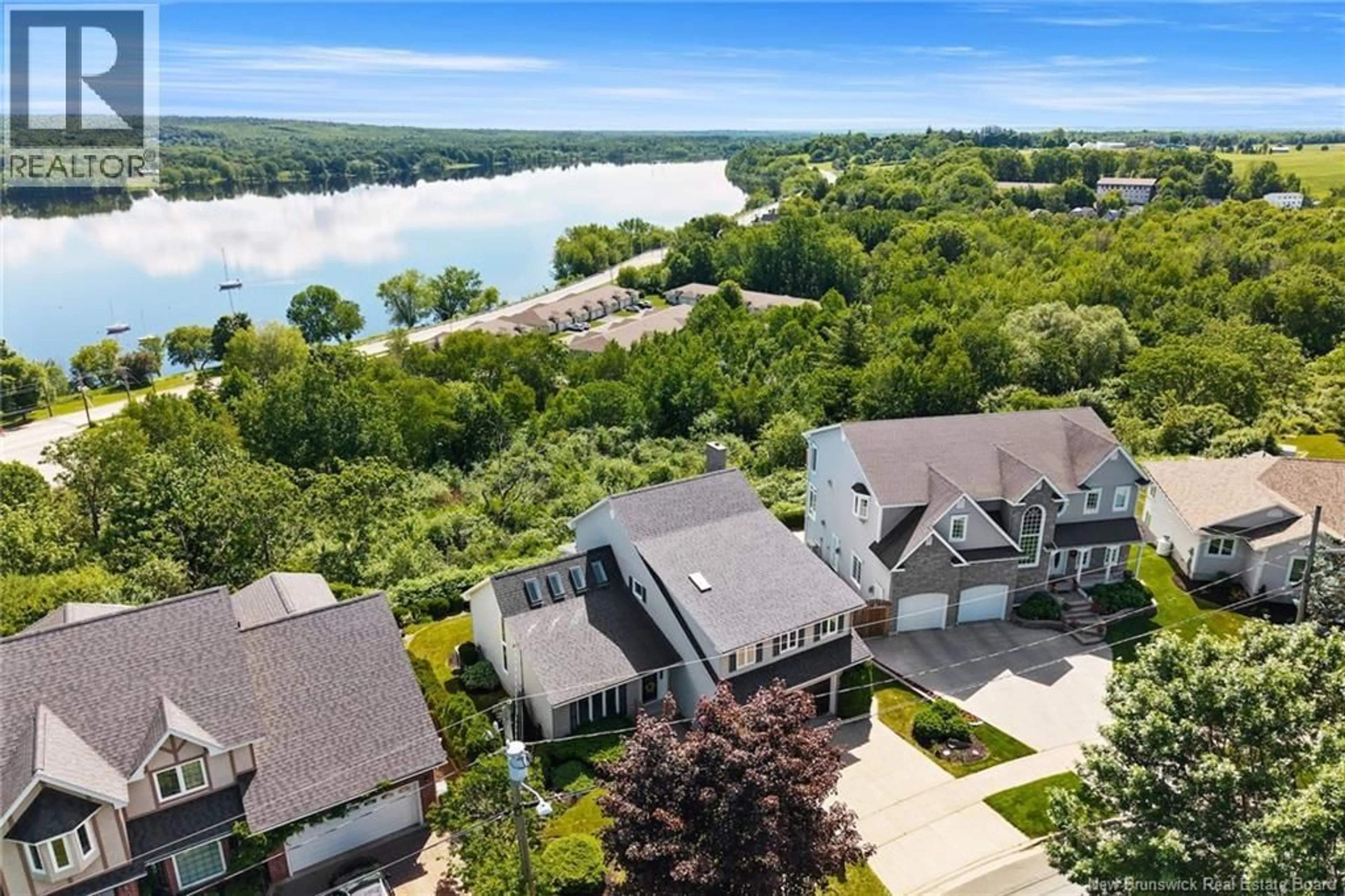 A pic from outside/outdoor area/front of a property/back of a property/a pic from drone, water/lake/river/ocean view for 407 ASPENDALE LANE, Fredericton New Brunswick E3B6Y3