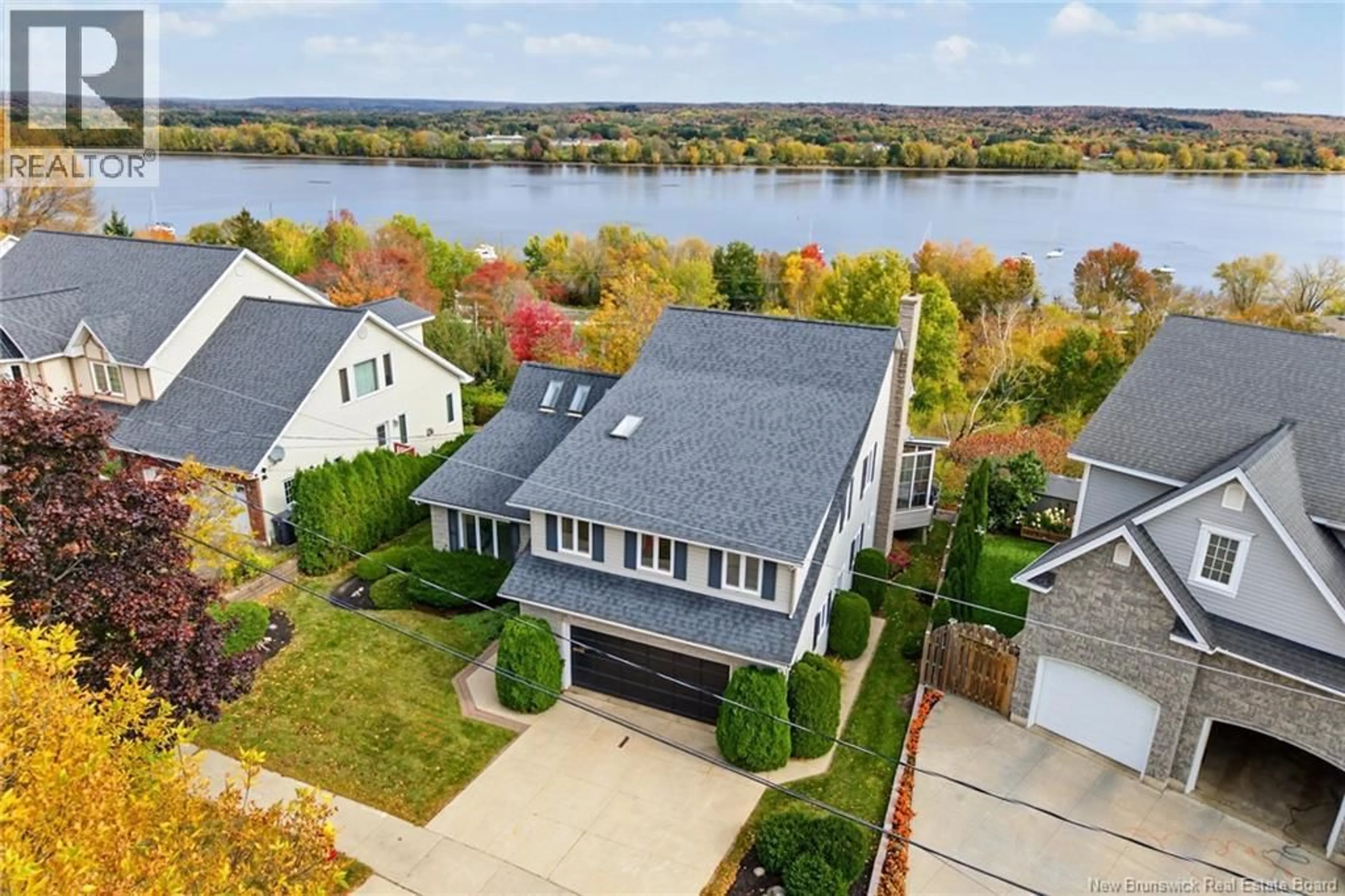 A pic from outside/outdoor area/front of a property/back of a property/a pic from drone, water/lake/river/ocean view for 407 ASPENDALE LANE, Fredericton New Brunswick E3B6Y3