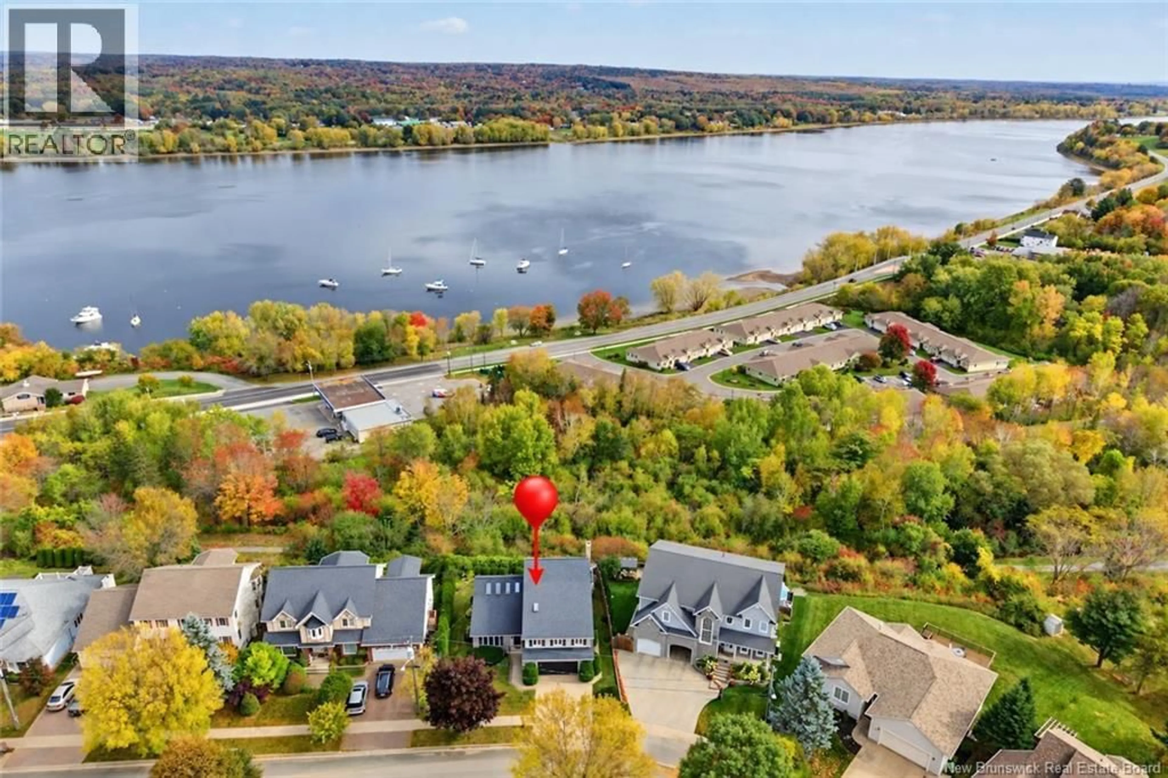 A pic from outside/outdoor area/front of a property/back of a property/a pic from drone, water/lake/river/ocean view for 407 ASPENDALE LANE, Fredericton New Brunswick E3B6Y3