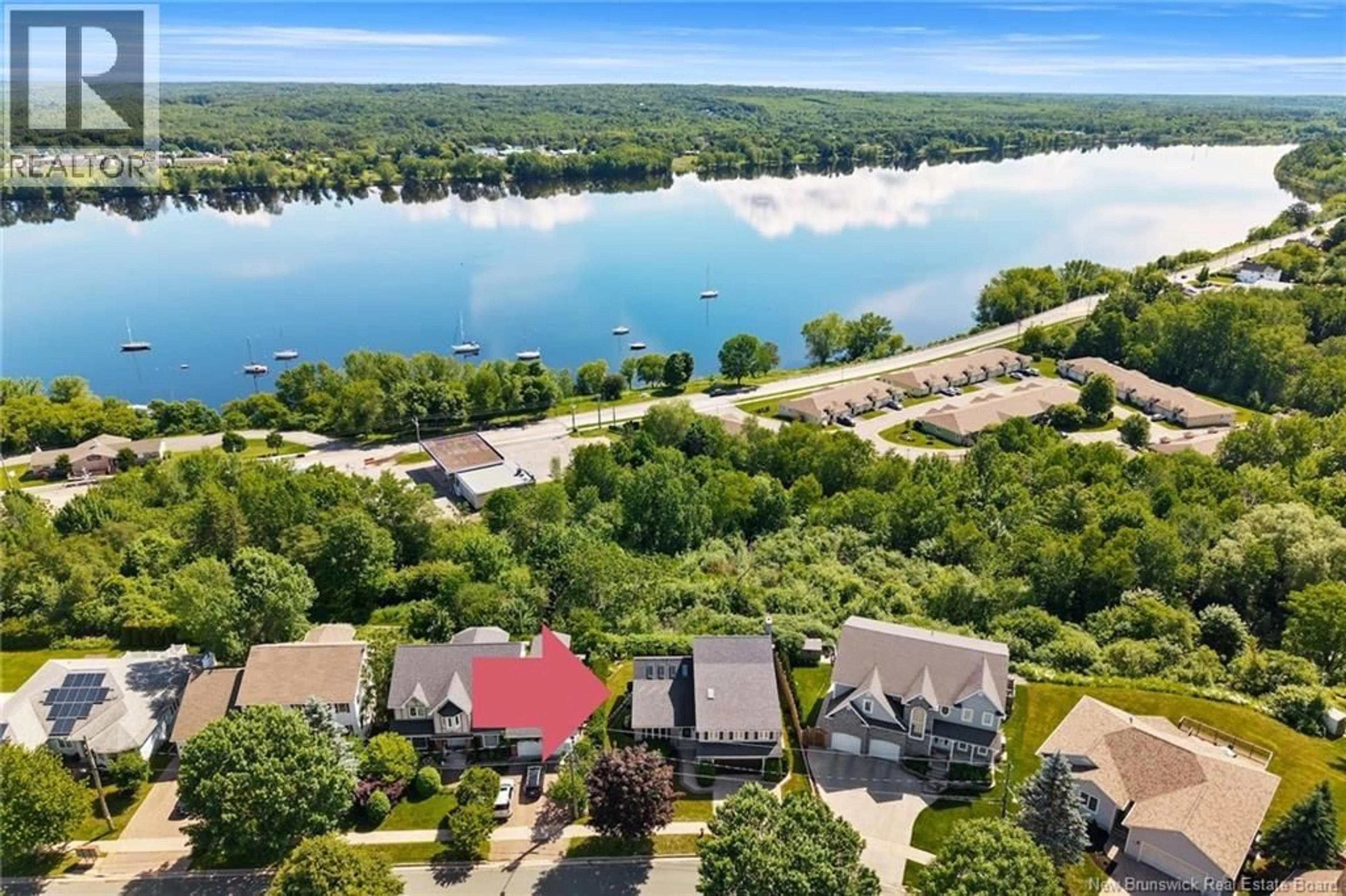 A pic from outside/outdoor area/front of a property/back of a property/a pic from drone, water/lake/river/ocean view for 407 ASPENDALE LANE, Fredericton New Brunswick E3B6Y3