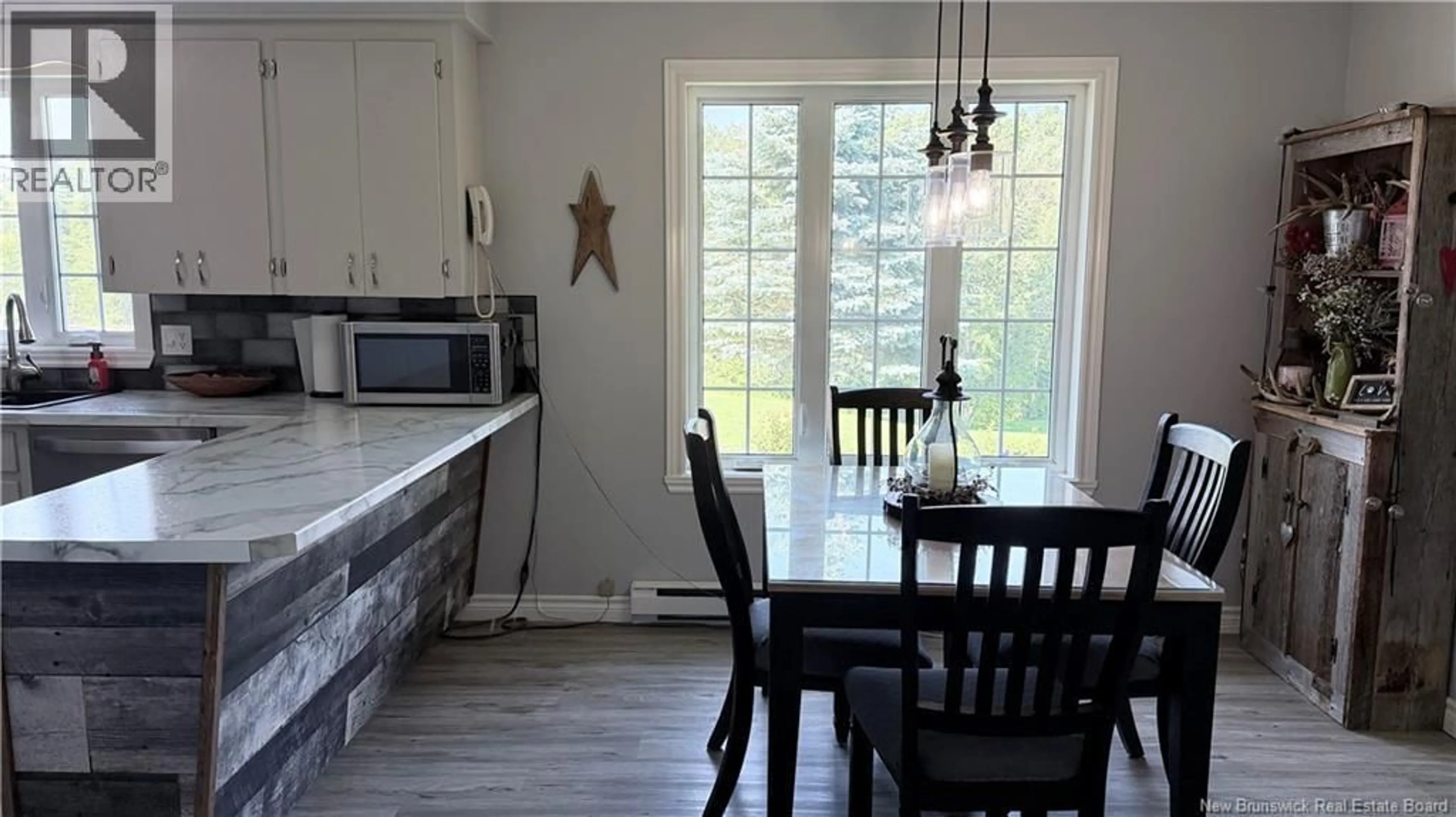 Open concept kitchen, wood/laminate floor for 35 MICHAUD STREET, Grand Falls New Brunswick E3Z1L5