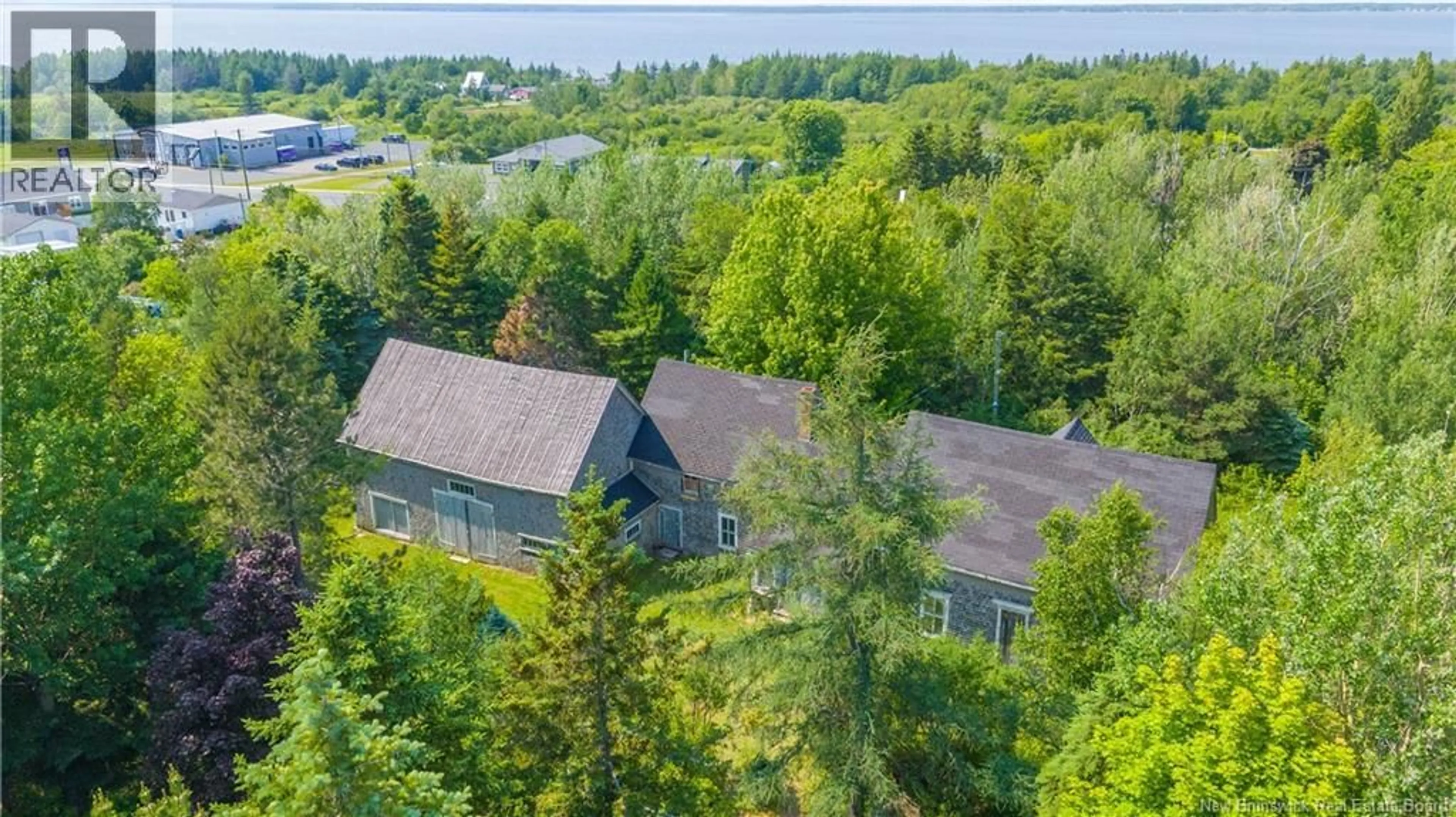 A pic from outside/outdoor area/front of a property/back of a property/a pic from drone, water/lake/river/ocean view for 325 SAVOIE STREET, Caraquet New Brunswick E1W1A3