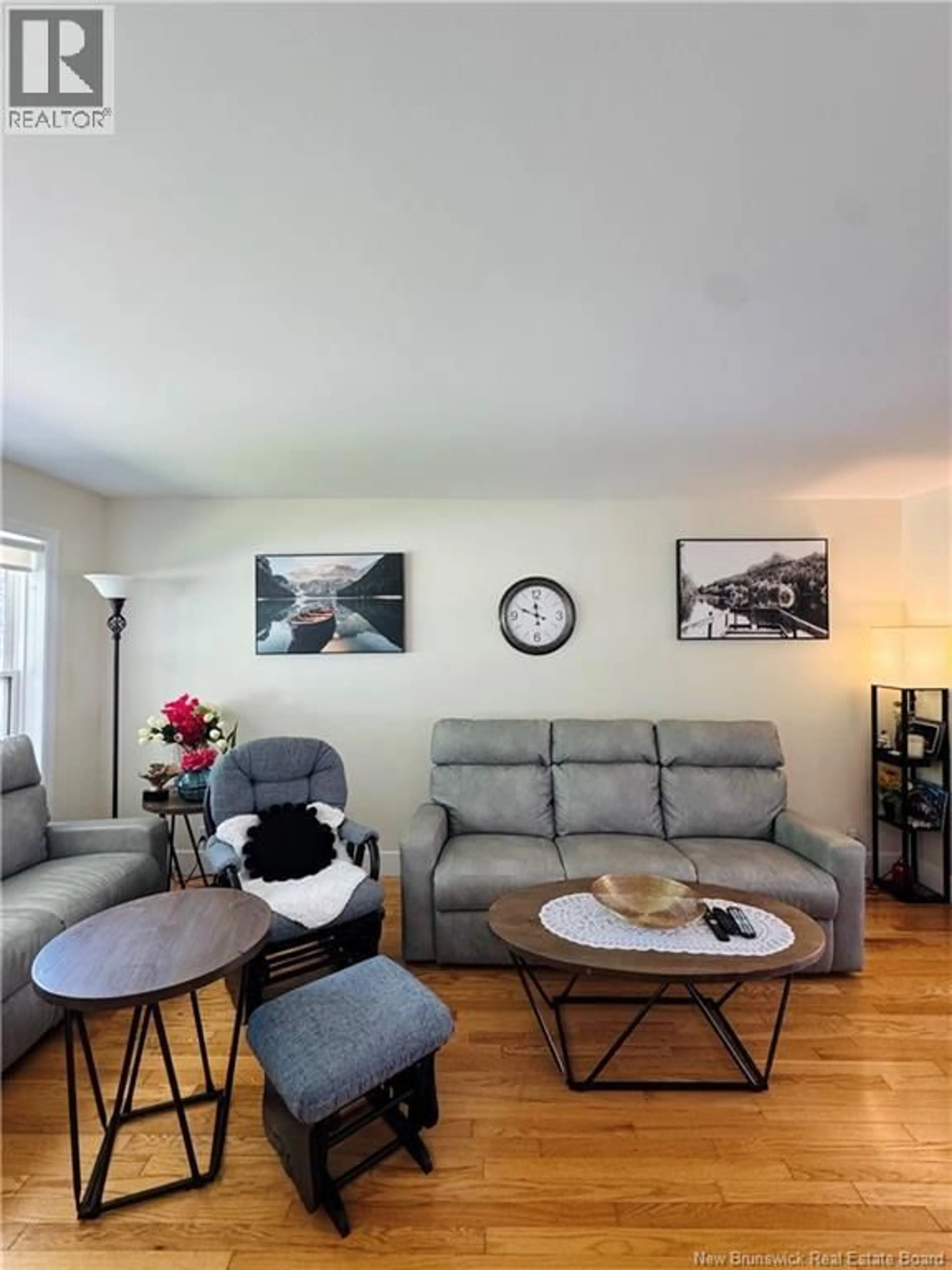 Living room with furniture, wood/laminate floor for 240 ALEXANDER STREET, Miramichi New Brunswick E1V1H3