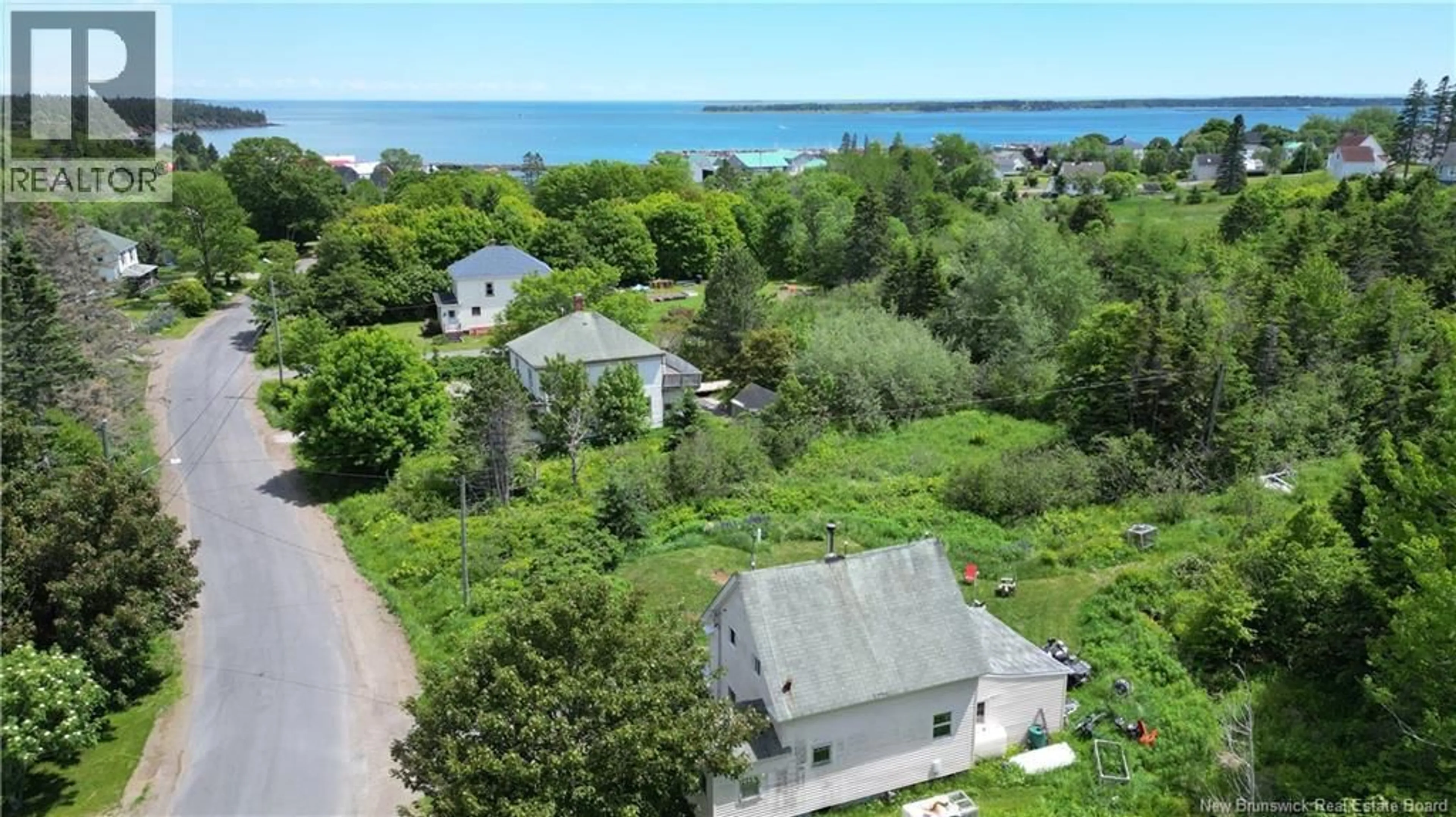 A pic from outside/outdoor area/front of a property/back of a property/a pic from drone, water/lake/river/ocean view for 27 KING STREET, Grand Manan New Brunswick E5G2J9