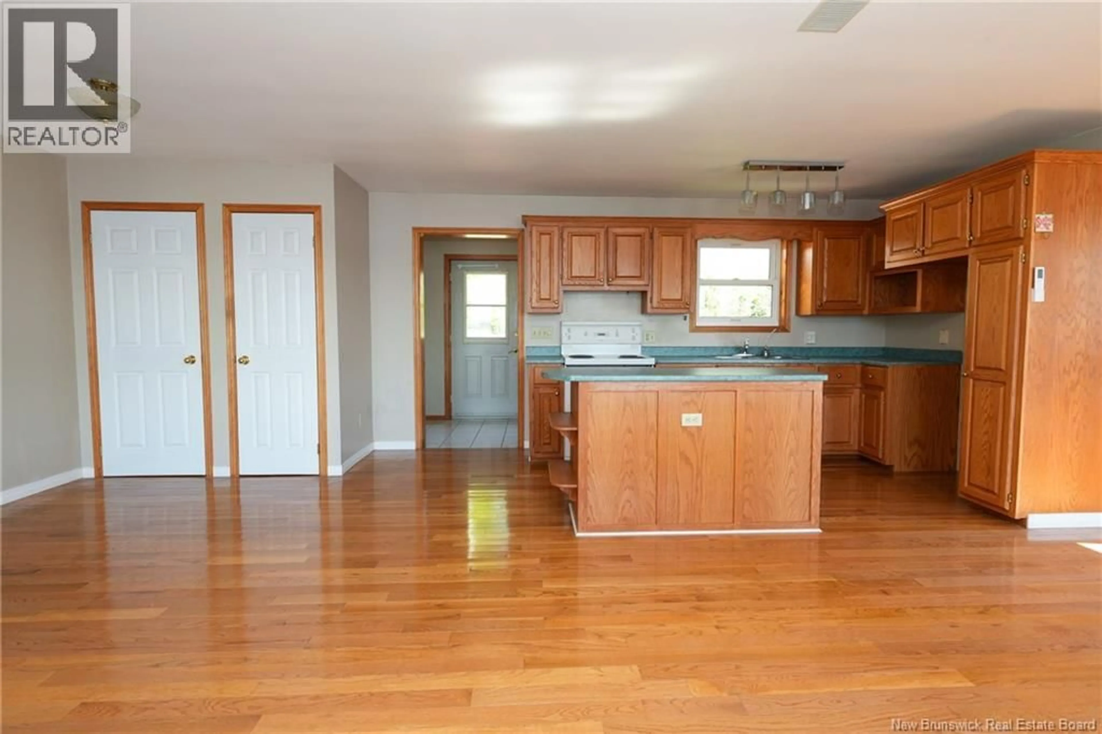 Open concept kitchen, wood/laminate floor for 28 EEL COVE ROAD, Utopia New Brunswick E5C2J4