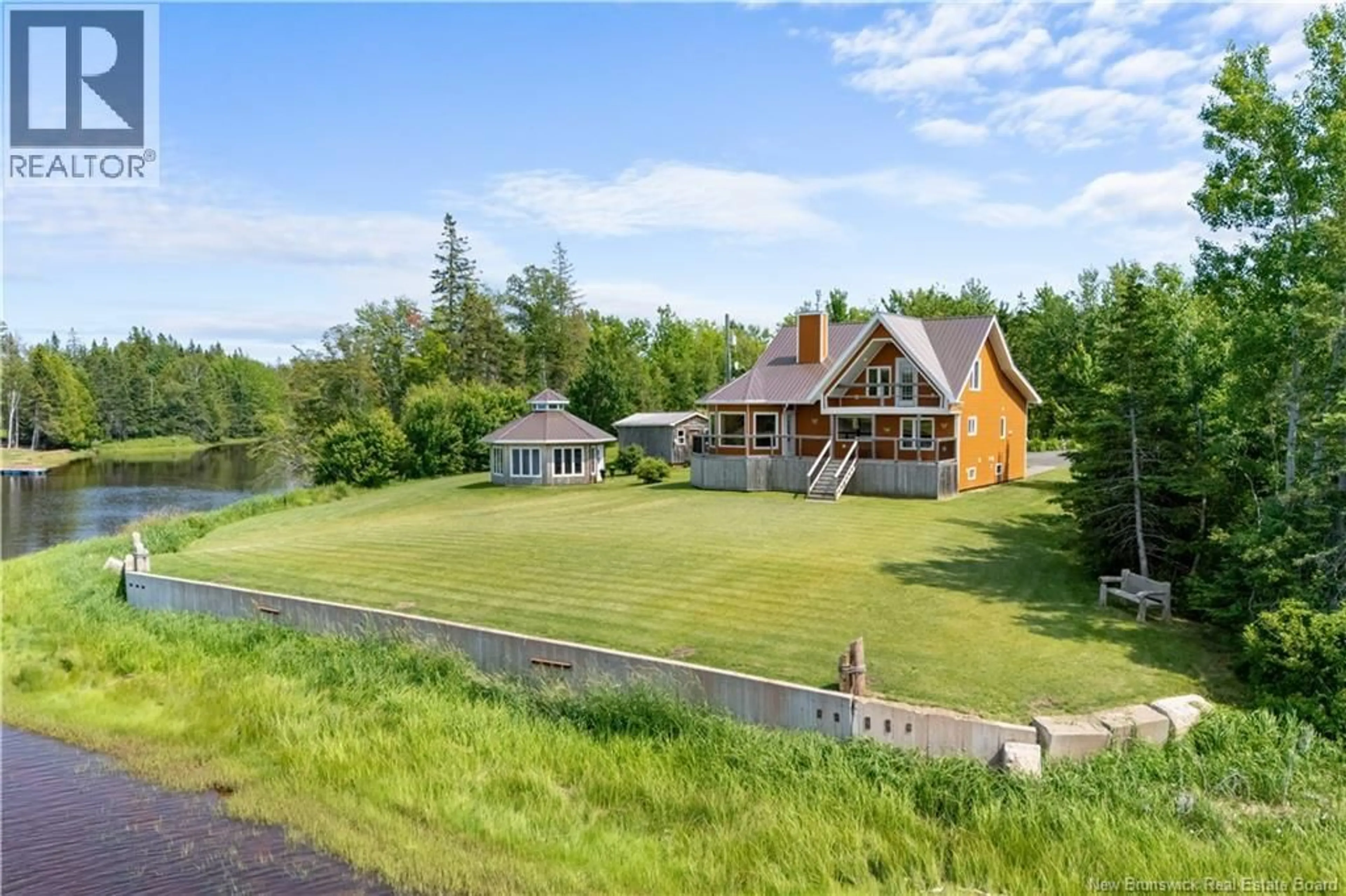 A pic from outside/outdoor area/front of a property/back of a property/a pic from drone, water/lake/river/ocean view for 235 RAYMEL, Grand-Barachois New Brunswick E4P7M7