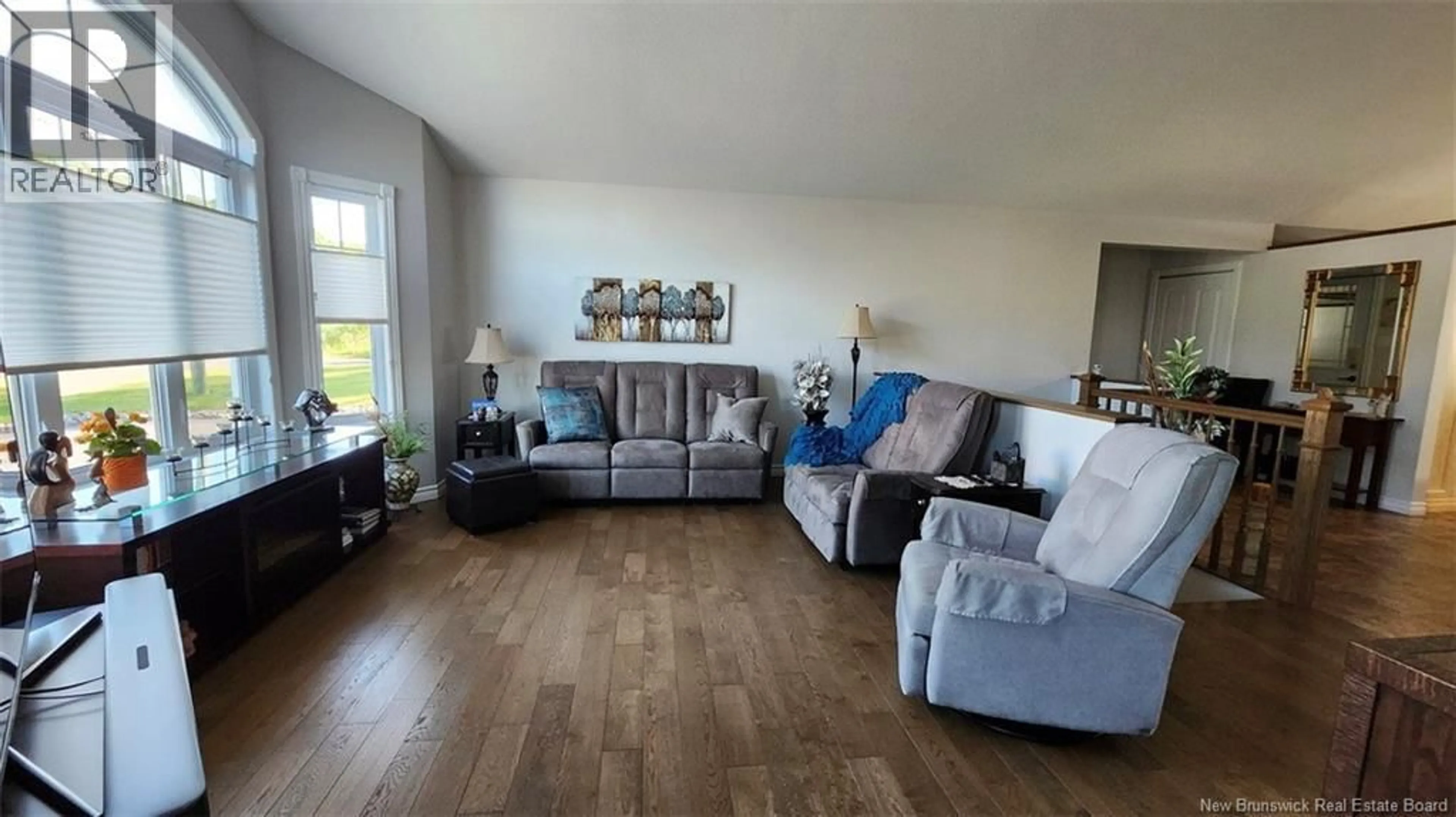 Living room with furniture, wood/laminate floor for 71 BREAU AVENUE, Edmundston New Brunswick E3V3Z4