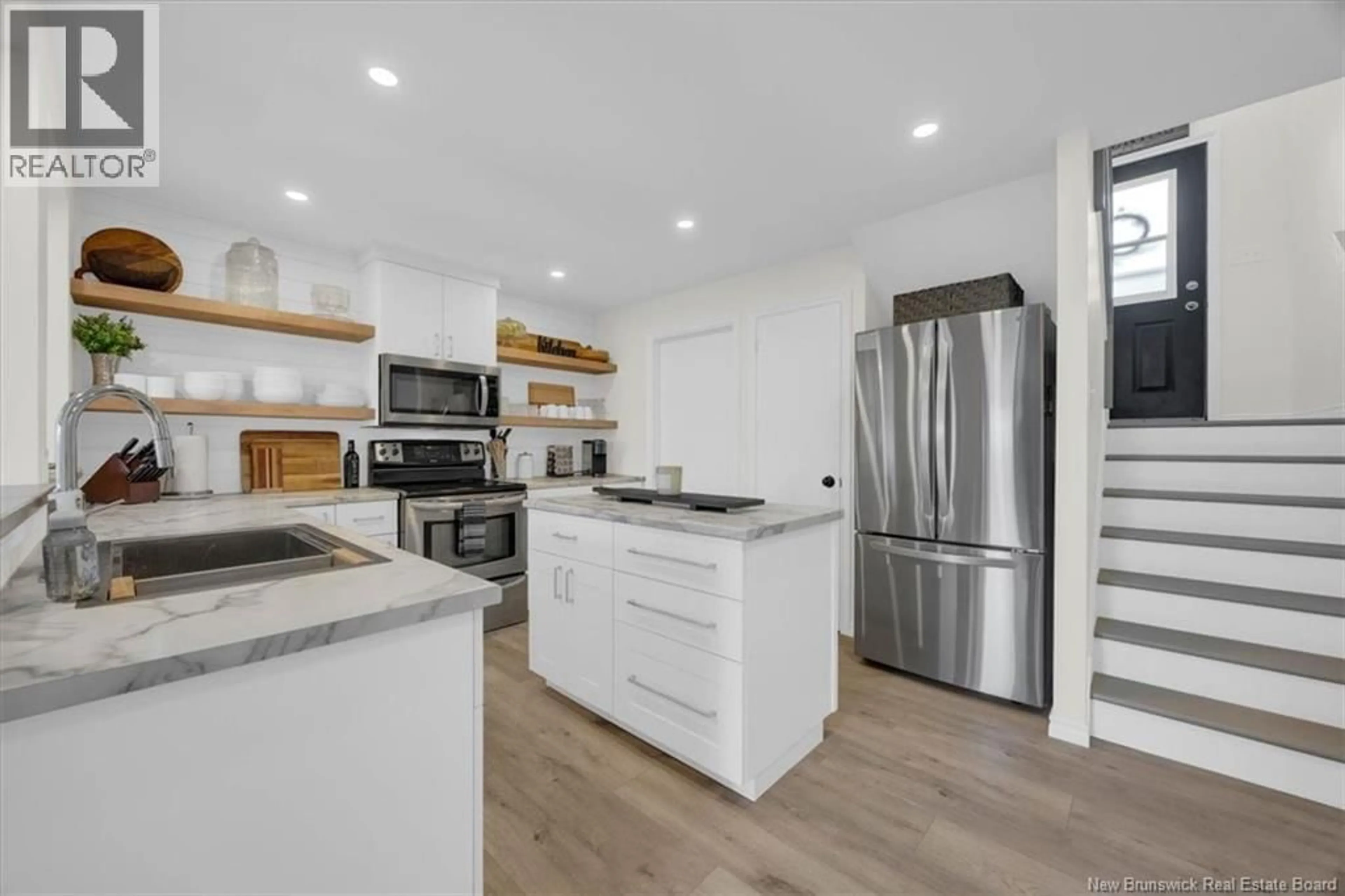 Open concept kitchen, wood/laminate floor for 524 HIGHMEADOW DRIVE, Saint John New Brunswick E2J3V1