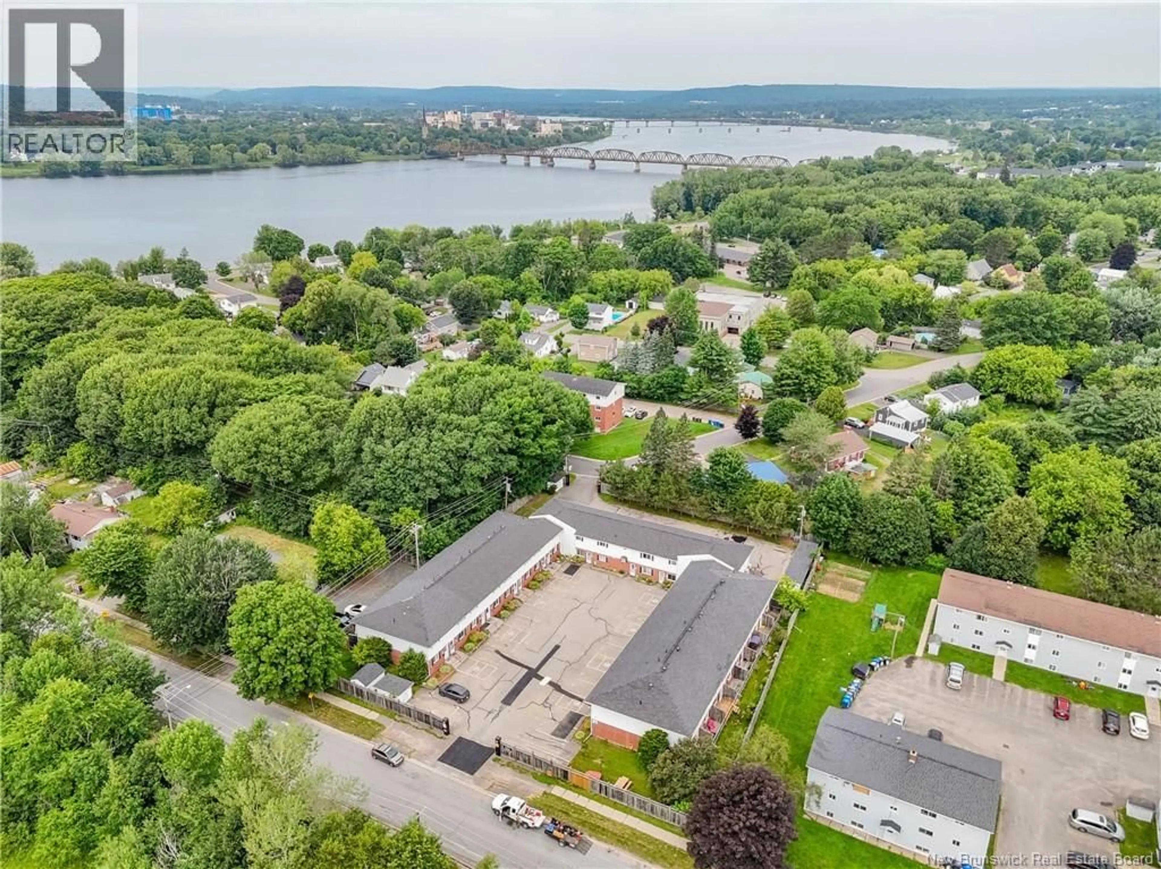 A pic from outside/outdoor area/front of a property/back of a property/a pic from drone, water/lake/river/ocean view for 4 - 60 COLWELL DRIVE, Fredericton New Brunswick E3A3R6