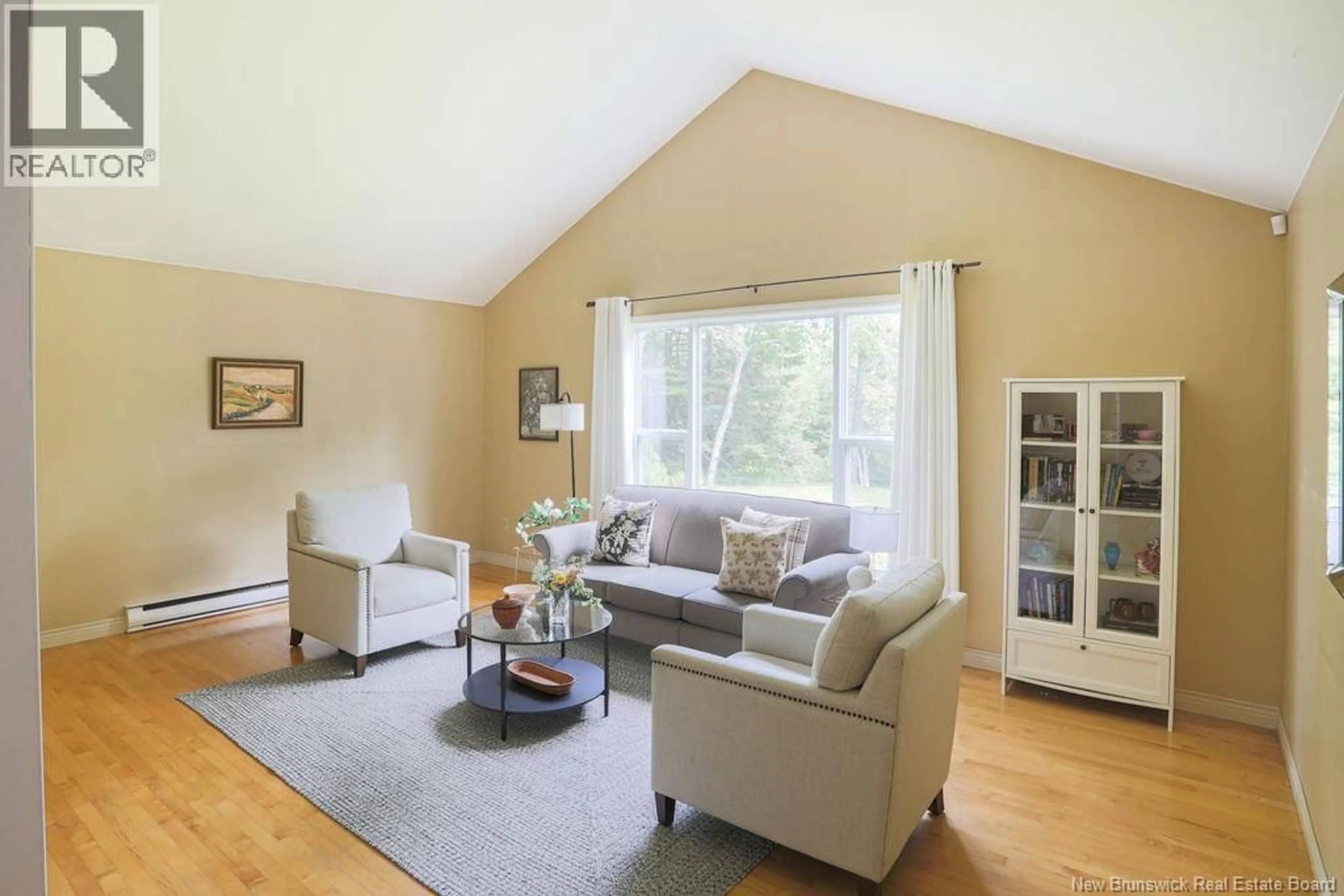 Living room with furniture, wood/laminate floor for 34 MALISEET DRIVE, Rothesay New Brunswick E2E2G5