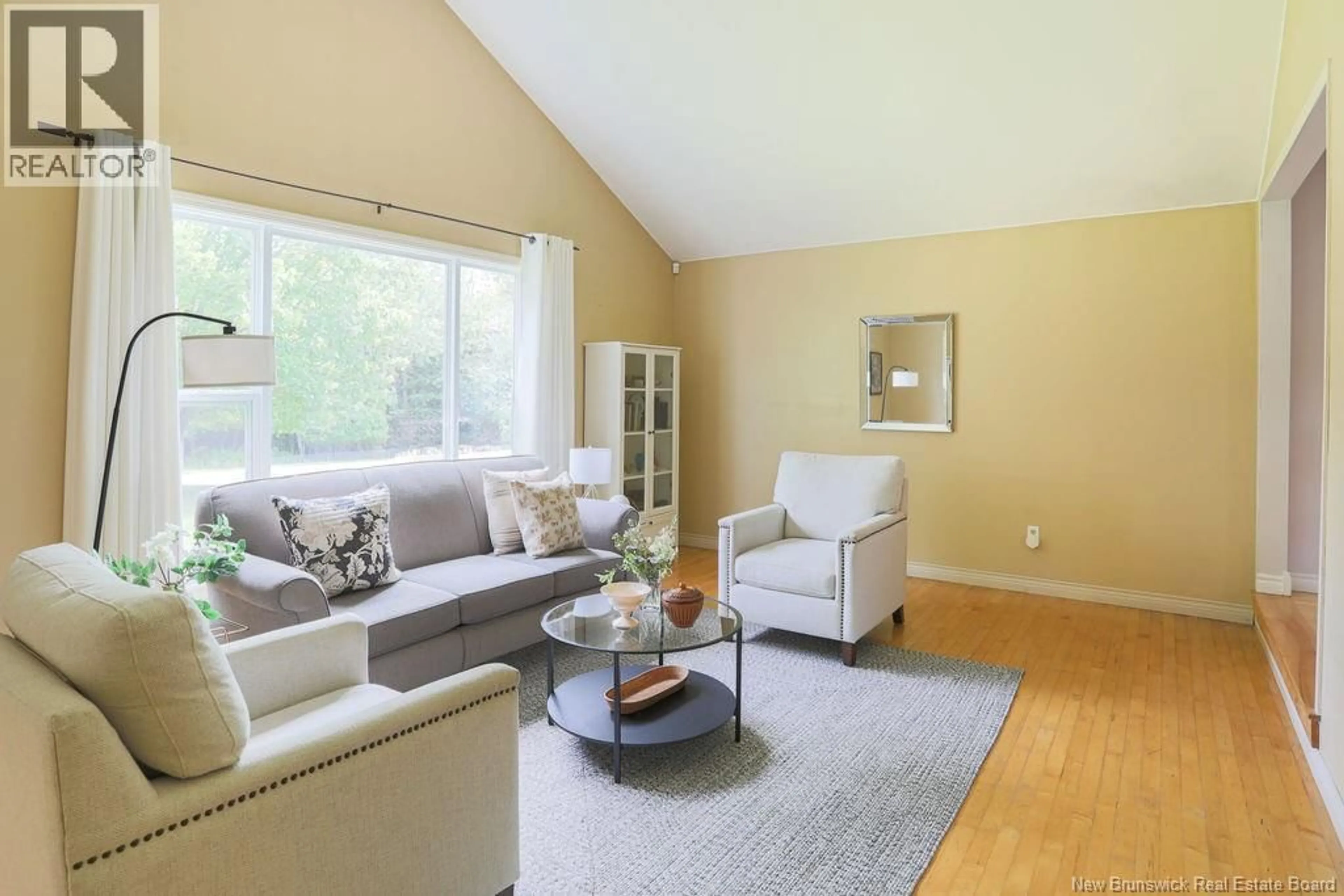 Living room with furniture, wood/laminate floor for 34 MALISEET DRIVE, Rothesay New Brunswick E2E2G5