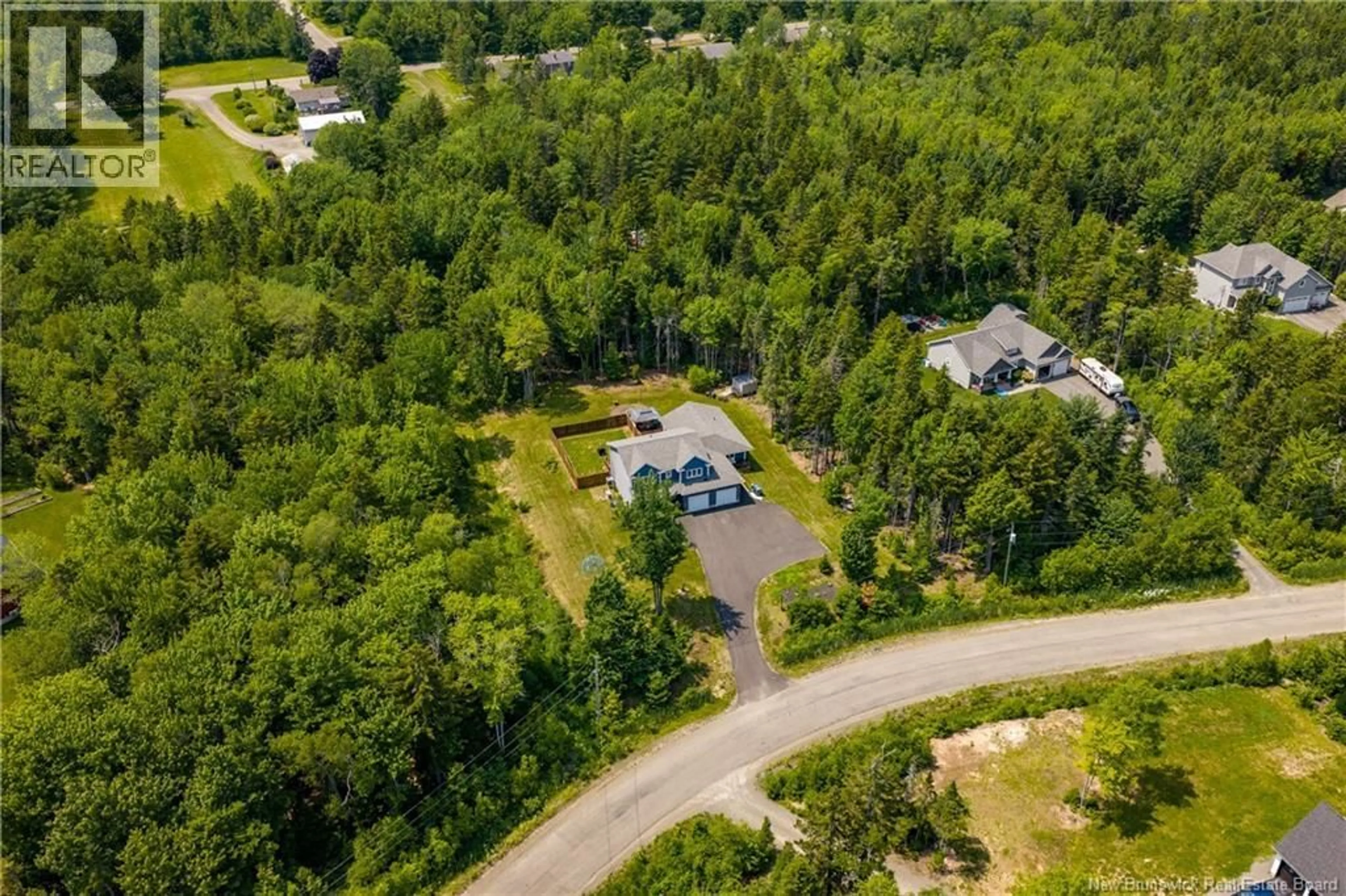 A pic from outside/outdoor area/front of a property/back of a property/a pic from drone, forest/trees view for 11 AMBER RIDGE, Berry Mills New Brunswick E1G5R3