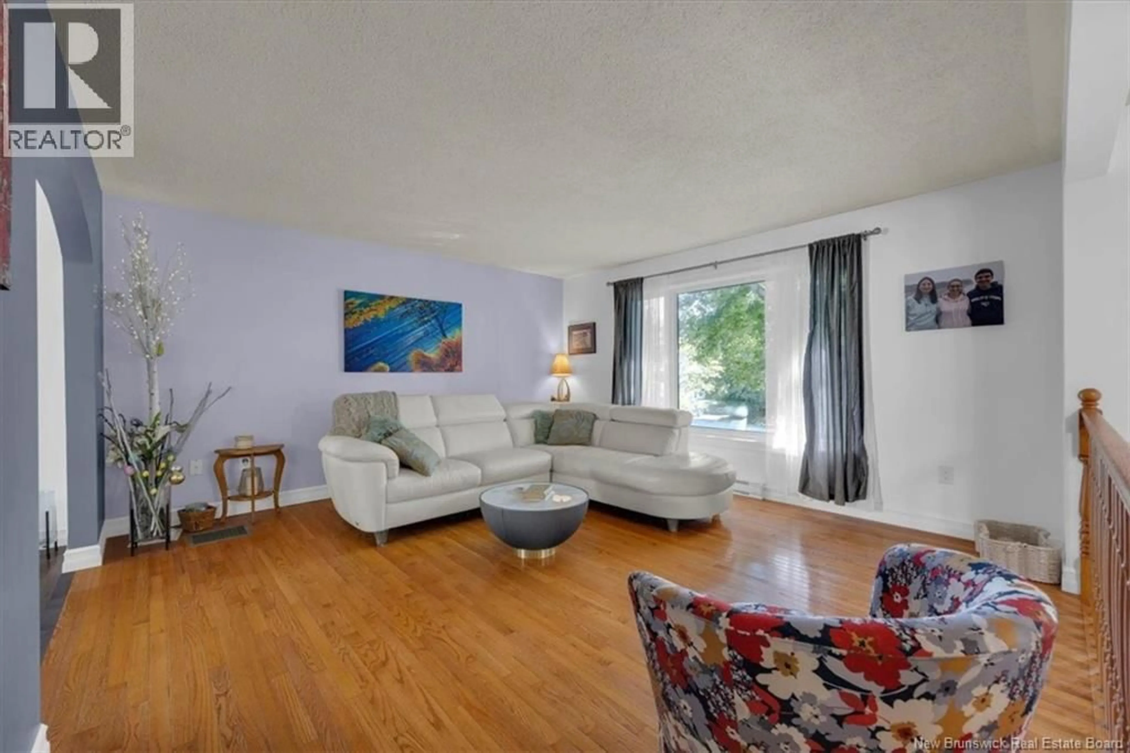 Living room with furniture, wood/laminate floor for 69 RENSHAW ROAD, Rothesay New Brunswick E2H1R7