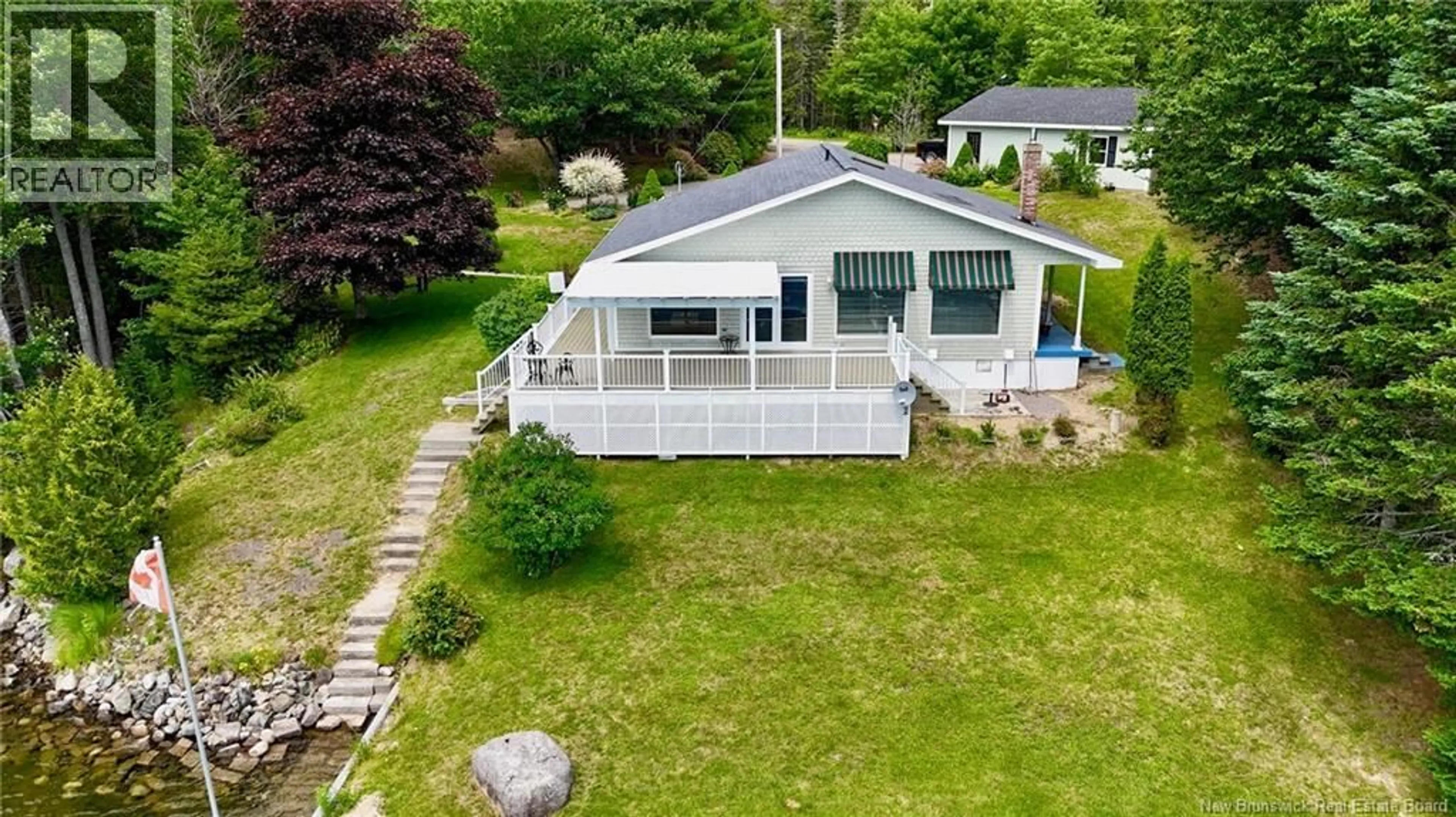 A pic from outside/outdoor area/front of a property/back of a property/a pic from drone, water/lake/river/ocean view for 106 LAKESIDE DR, Bayside New Brunswick E5B2X9