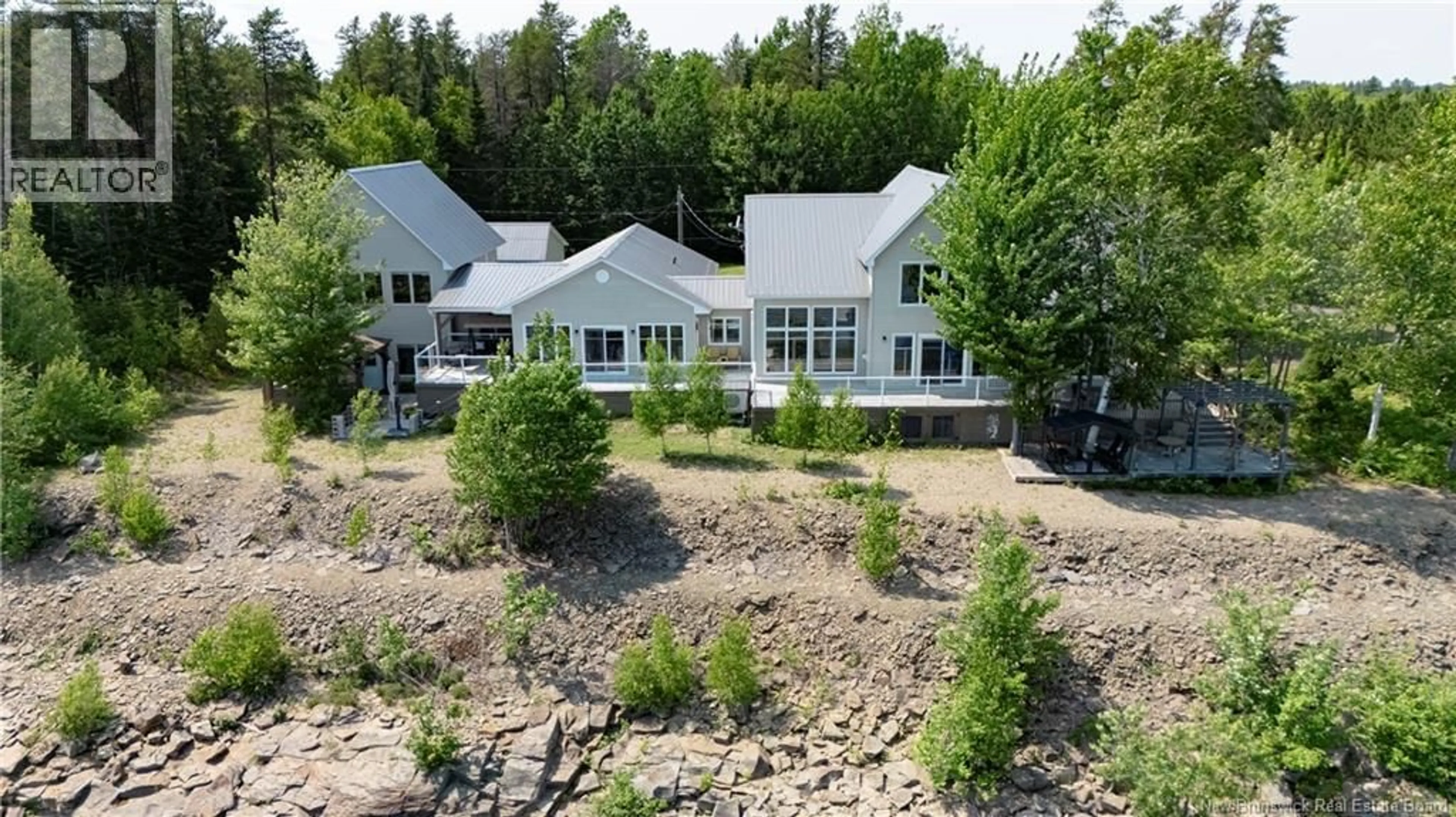 A pic from outside/outdoor area/front of a property/back of a property/a pic from drone, unknown for 72 COTTAGE ROAD, Printz Cove New Brunswick E4B4A3