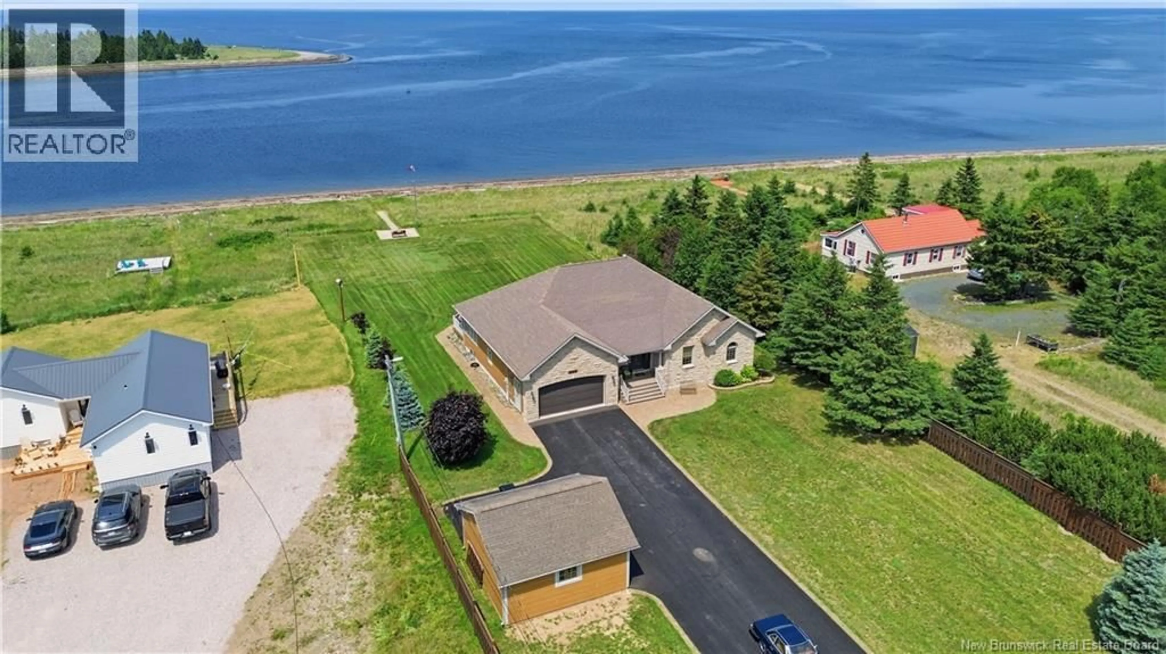 A pic from outside/outdoor area/front of a property/back of a property/a pic from drone, water/lake/river/ocean view for 51 BAYSHORE DRIVE, Bathurst New Brunswick E2A6A5