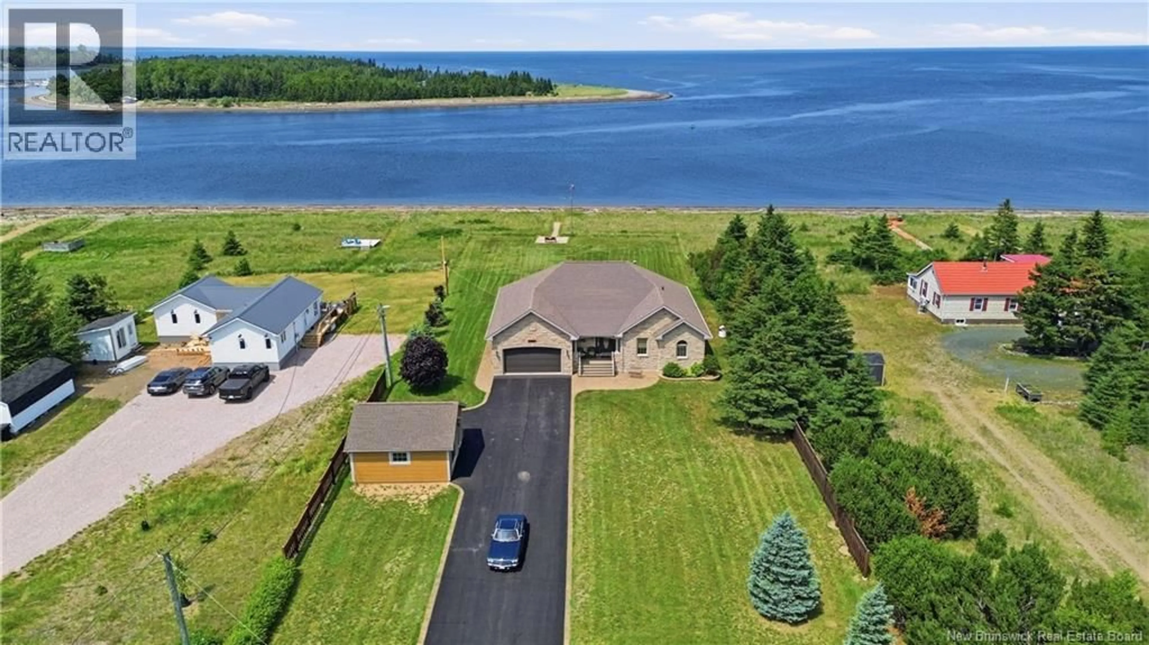 A pic from outside/outdoor area/front of a property/back of a property/a pic from drone, water/lake/river/ocean view for 51 BAYSHORE DRIVE, Bathurst New Brunswick E2A6A5