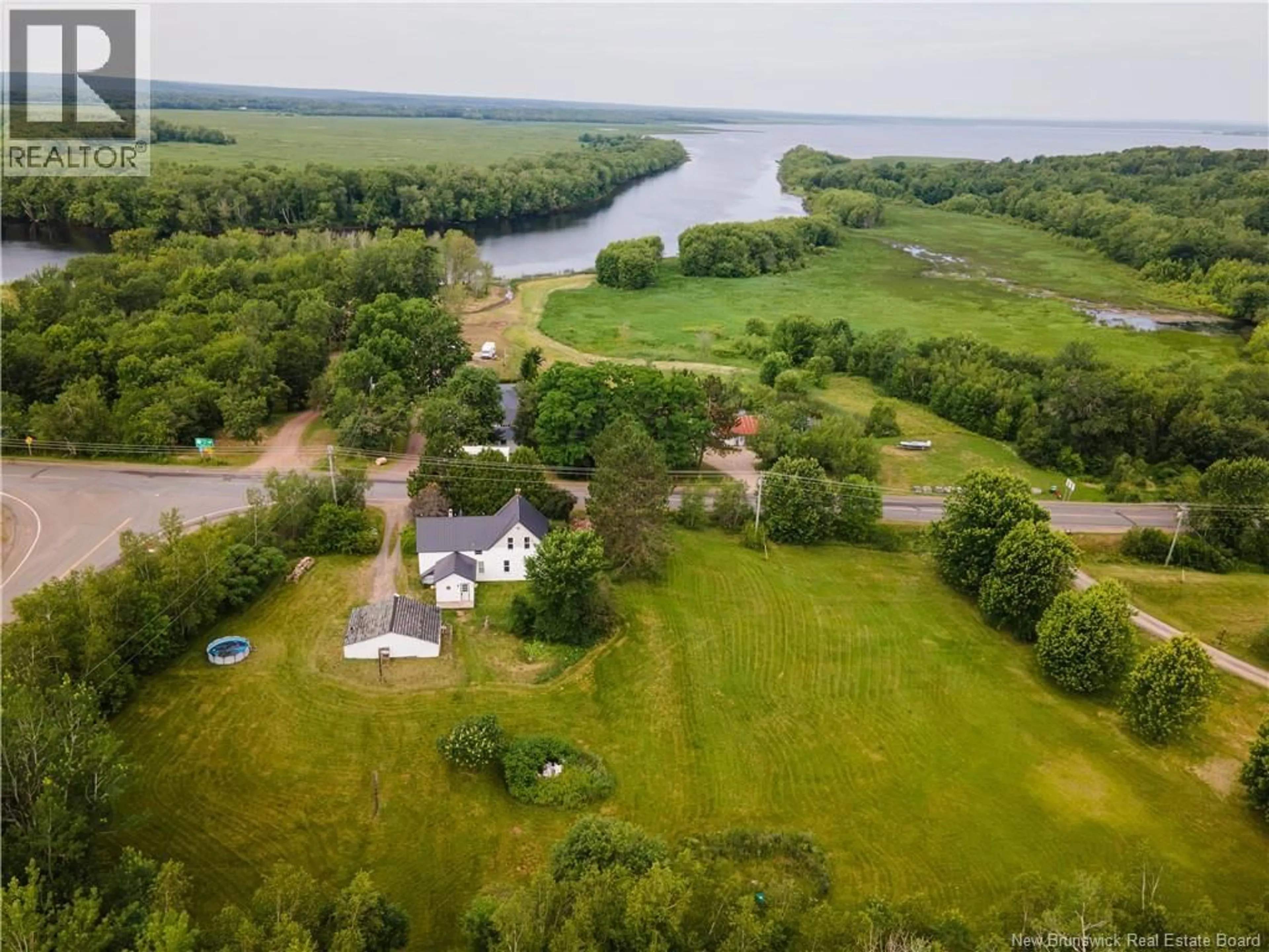 A pic from outside/outdoor area/front of a property/back of a property/a pic from drone, water/lake/river/ocean view for 4390 ROUTE 105, Jemseg New Brunswick E4C3K1