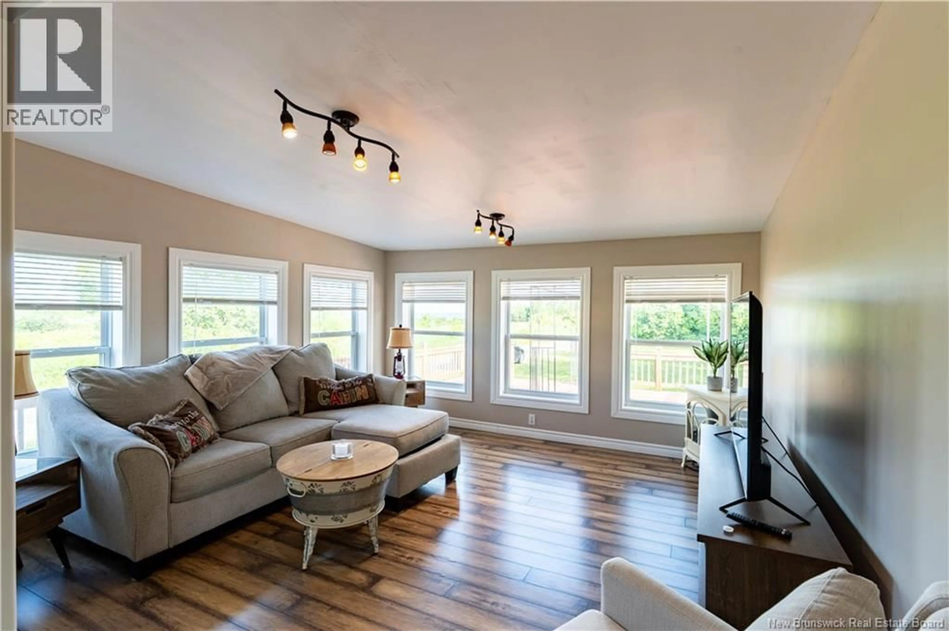 Living room with furniture, wood/laminate floor for 4 GREGG STREET, Baie-Sainte-Anne New Brunswick E9A1B3