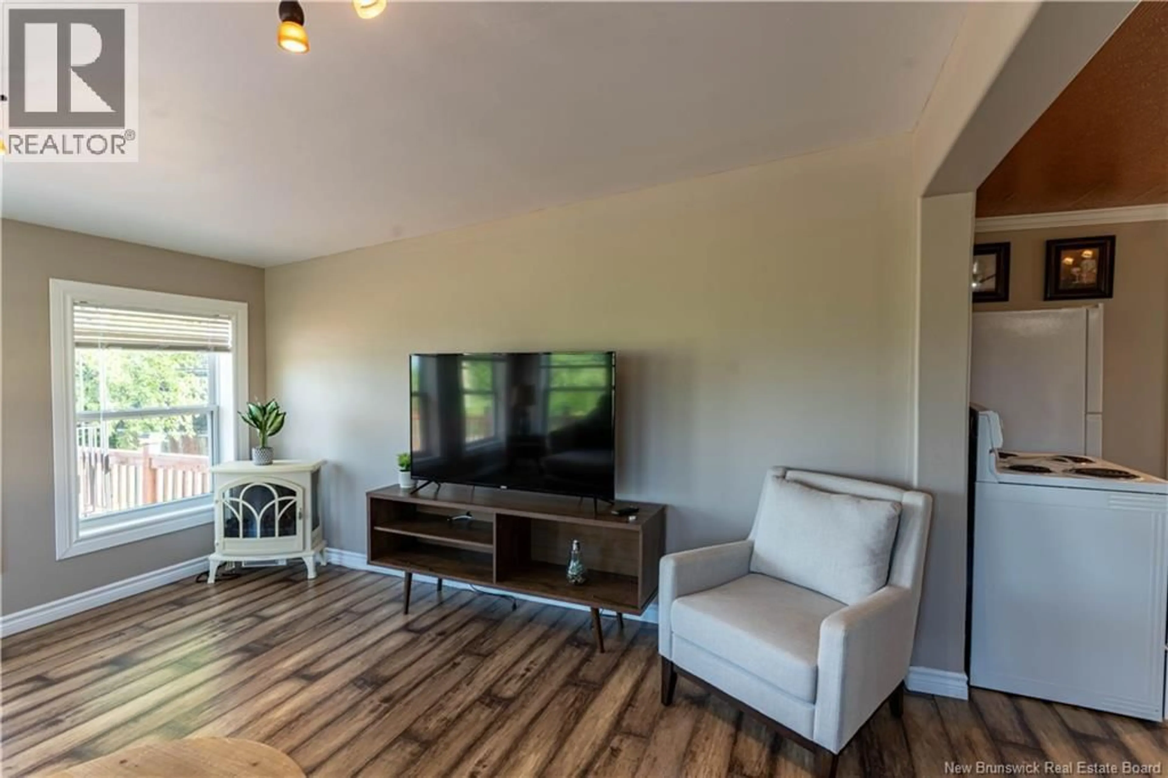 Living room with furniture, wood/laminate floor for 4 GREGG STREET, Baie-Sainte-Anne New Brunswick E9A1B3