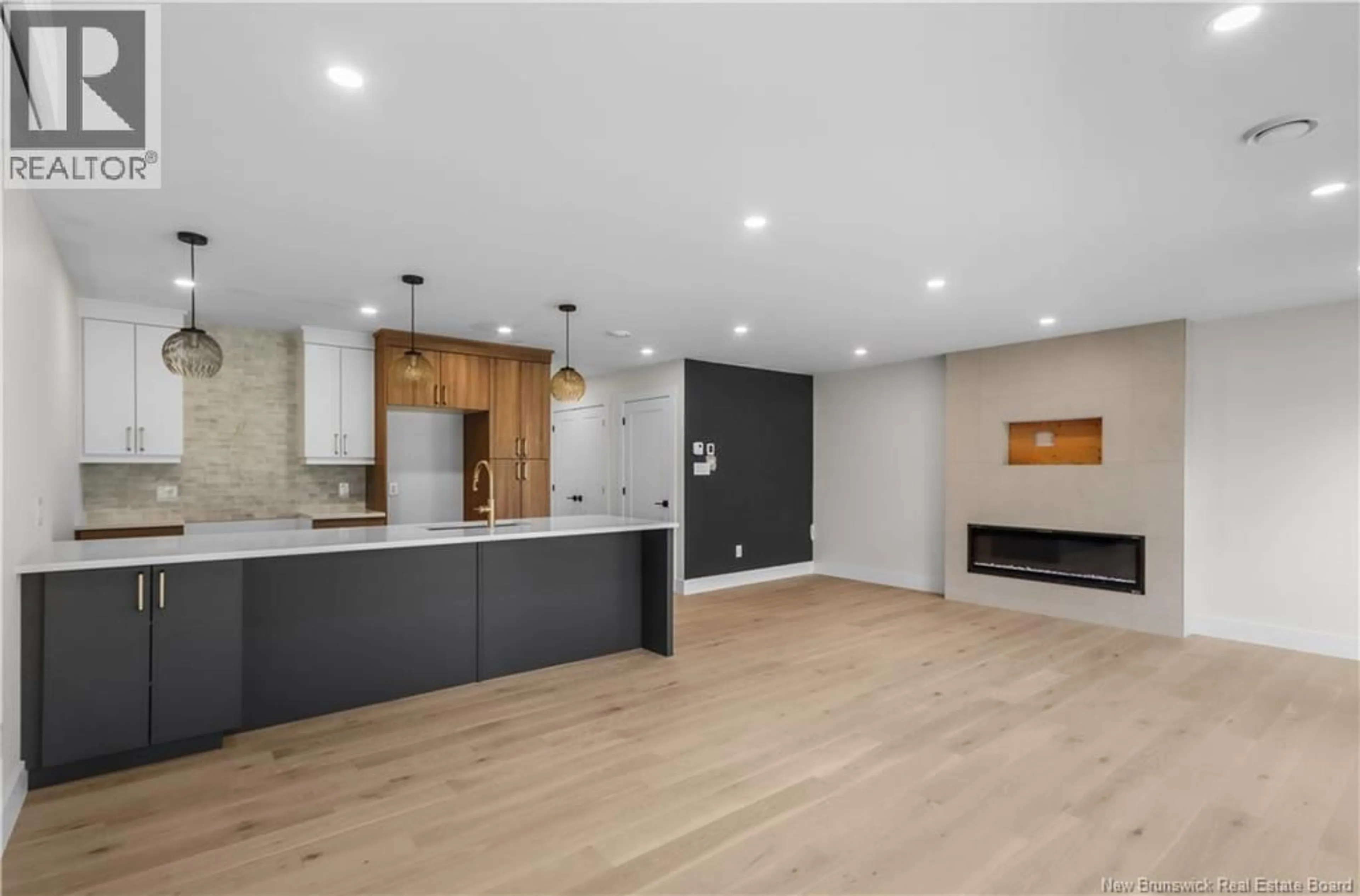 Open concept kitchen, wood/laminate floor for 20 VISION COURT, Dieppe New Brunswick E1K0A8