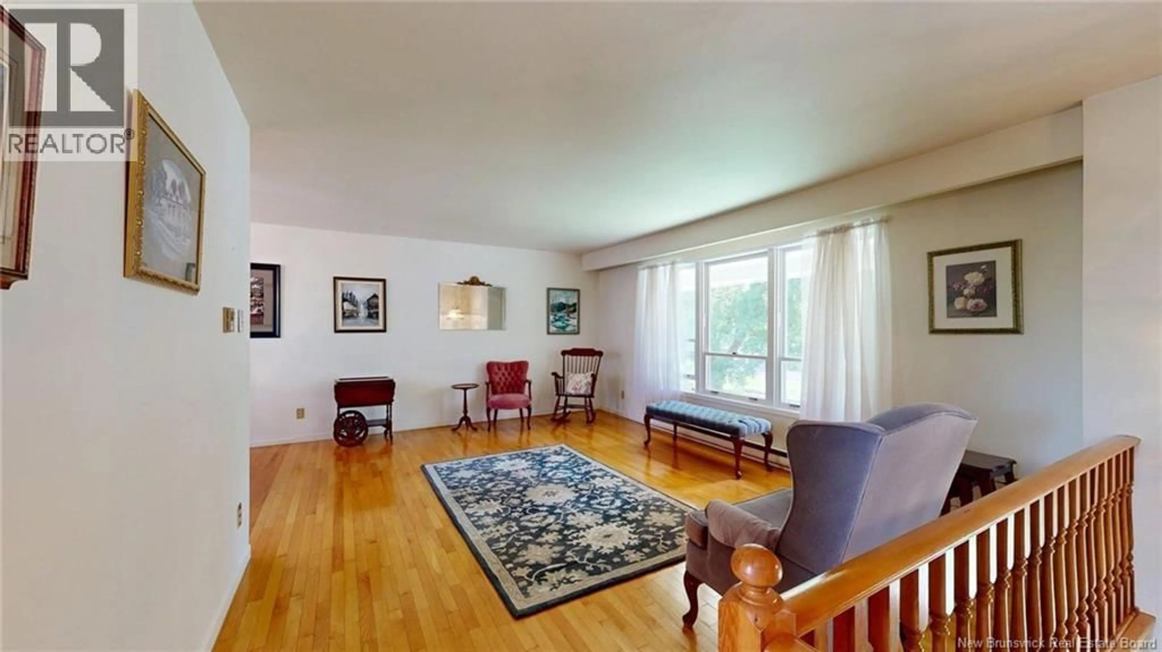 Living room with furniture, wood/laminate floor for 49 CEDAR RIDGE BOULEVARD, Quispamsis New Brunswick E2E4K6