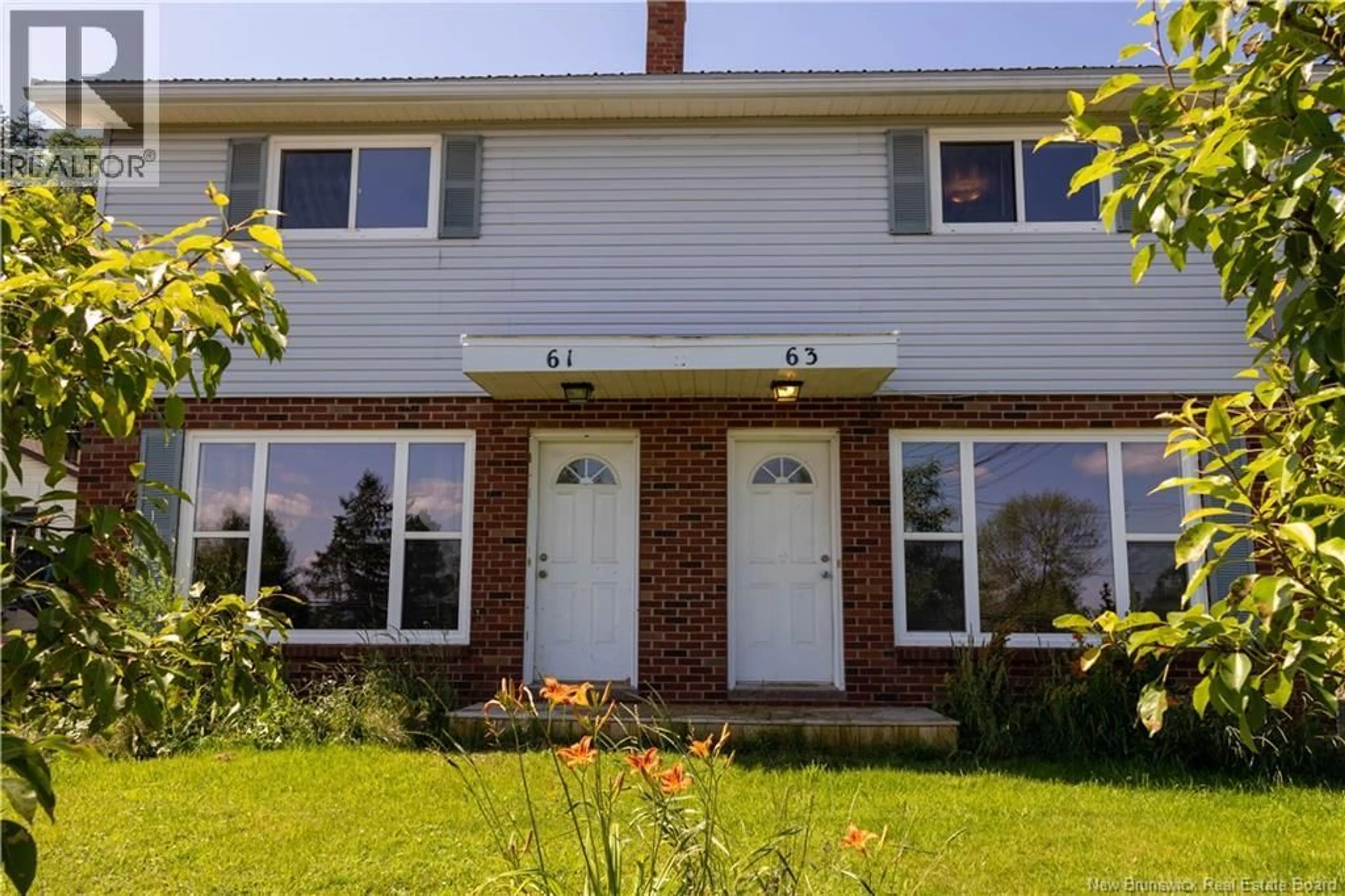 Home with brick exterior material, building for 61-63 AMMON ROAD, Ammon New Brunswick E1G3N7