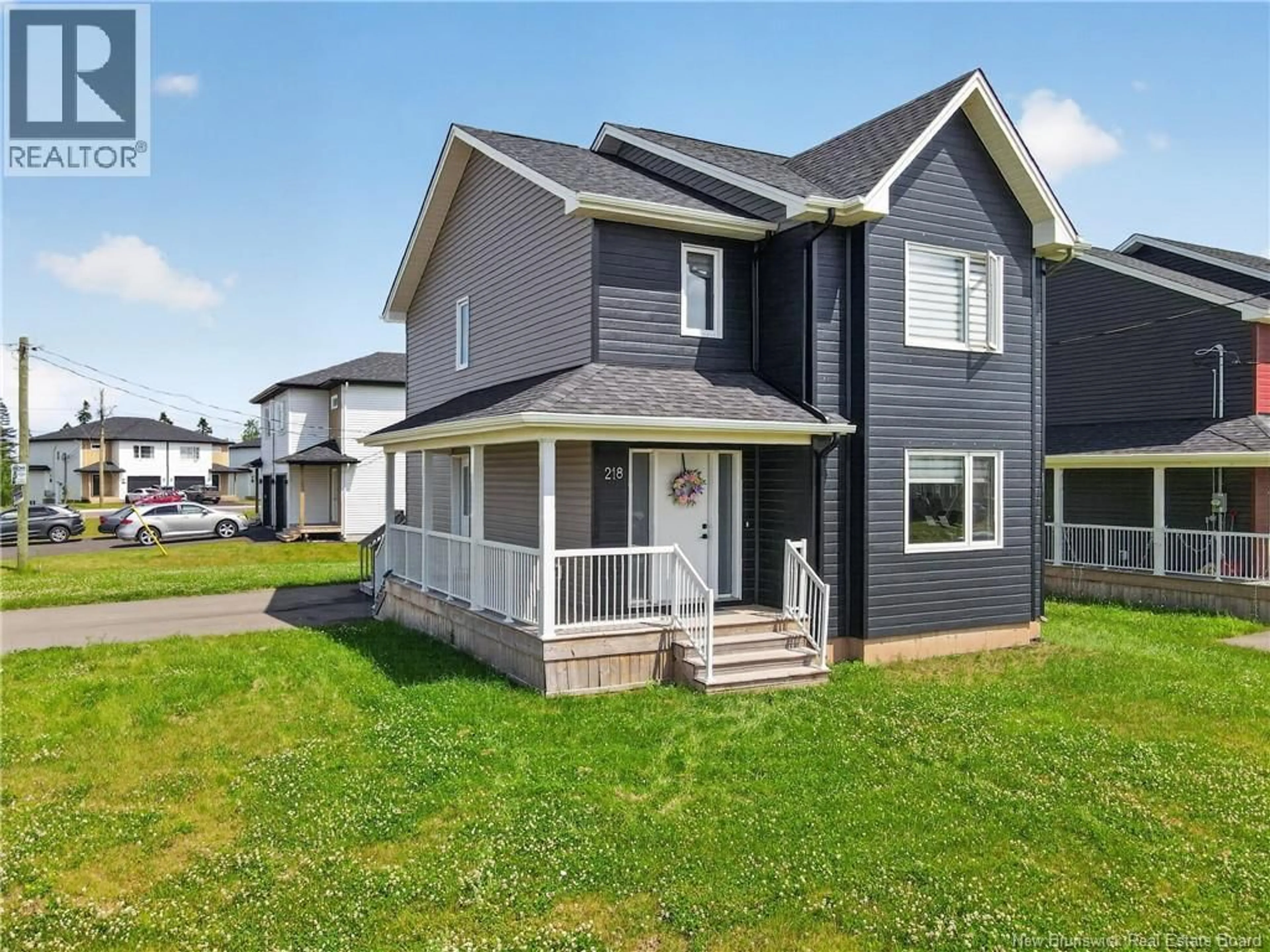 Home with vinyl exterior material, street for 218 FALCON DRIVE, Moncton New Brunswick E1H0H8